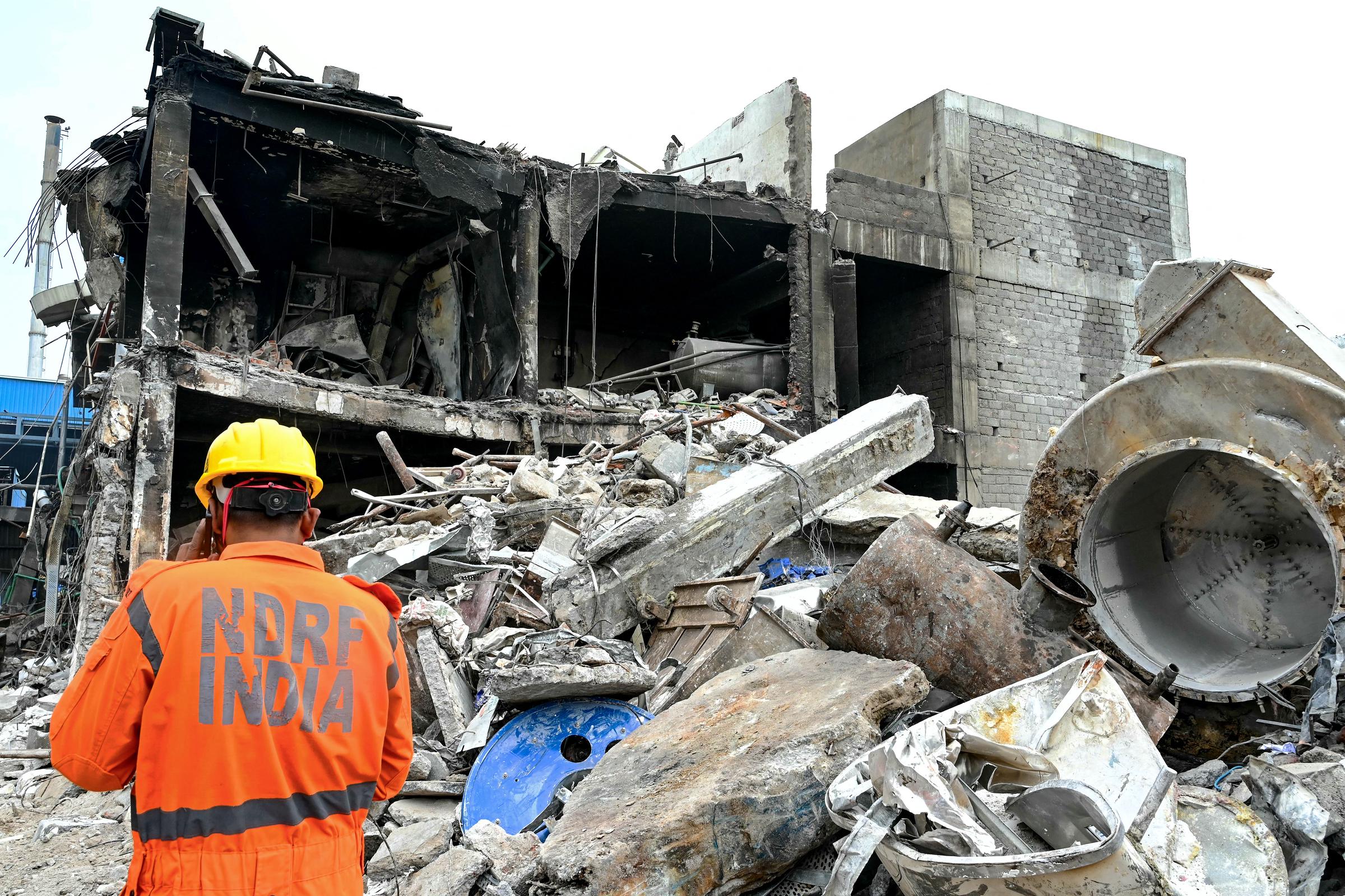 A rescue worker surveys the wreckage of the gutted Sigachi Industries plant in Telangana, a day after a deadly explosion reported on July 1, 2025 | Source: Getty Images