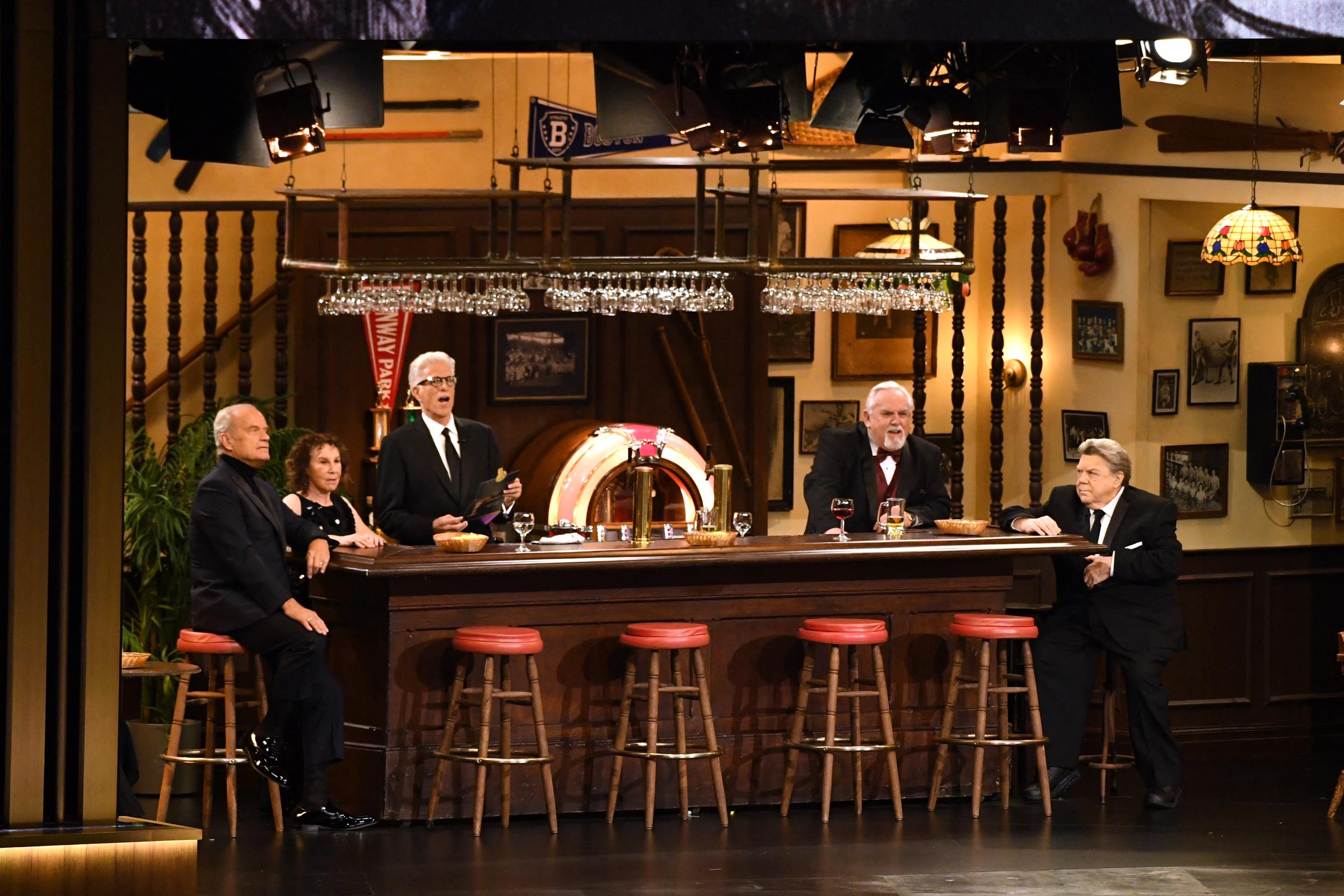 George Wendt (far right) joins "Cheers" cast members Ted Danson, Rhea Perlman, Kelsey Grammer, and John Ratzenberger onstage during a tribute at the 75th Emmy Awards on January 15, 2024 | Source: Getty Images