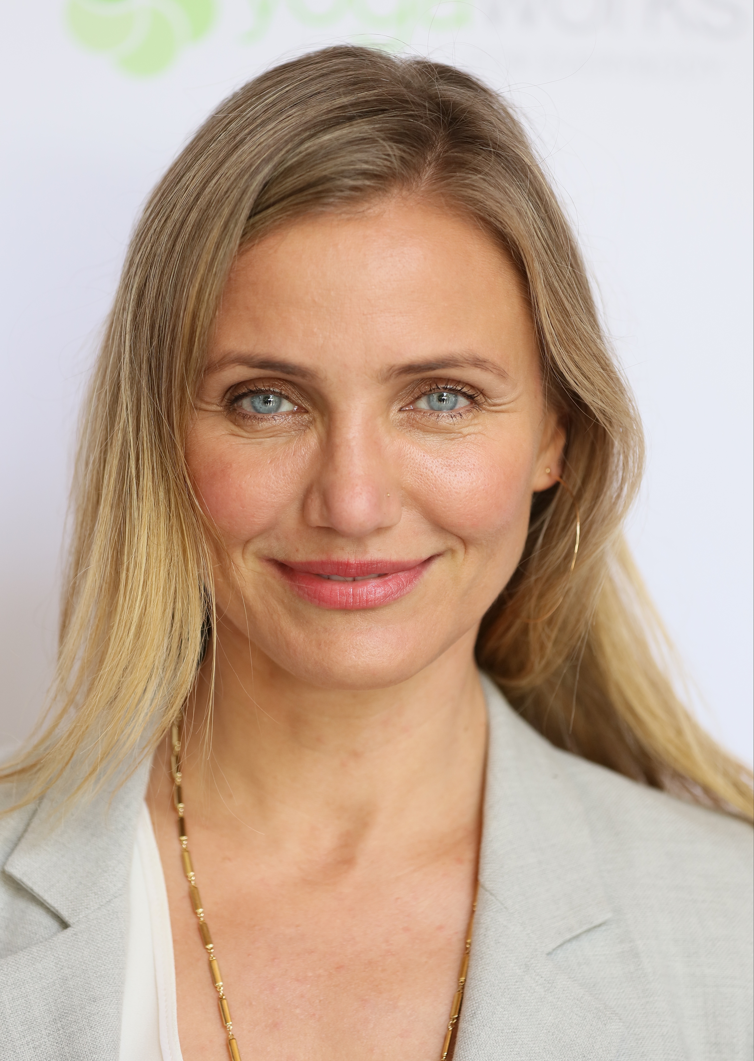Cameron Diaz attends an MPTF event celebrating health and fitness at The Wasserman Campus, wearing a light blazer with minimal makeup and her blonde hair styled straight, smiling softly for the camera.