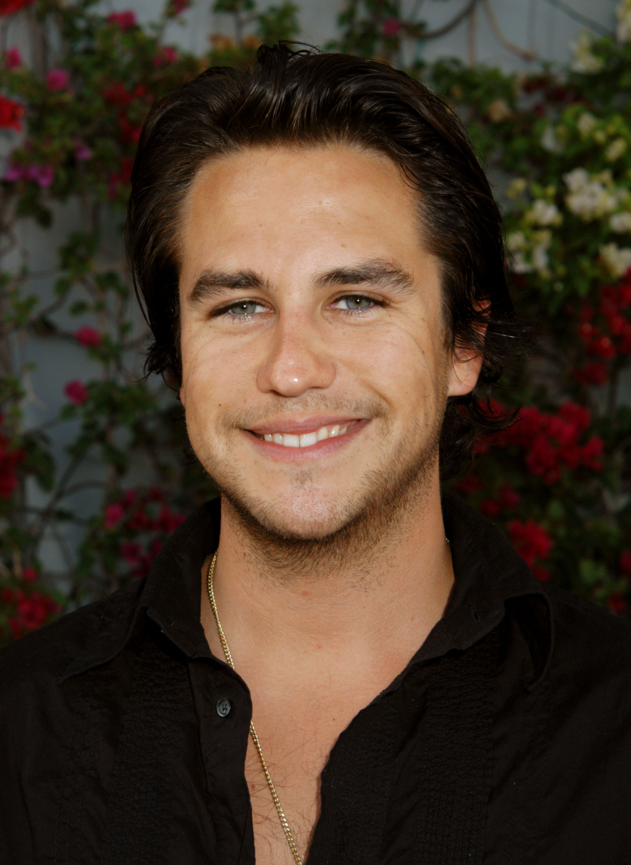 The singer attends the Fris Vodka Benefit for The Michael J. Fox Foundation, hosted by Federico Castelluccio at Skybar in the Mondrian Hotel, West Hollywood. He wears a black shirt with the top buttons undone, revealing a gold chain beneath, a laid-back yet stylish presence at the event.