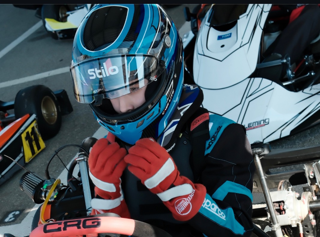Rocky Prinze sat behind the wheel of a go-kart, wearing a blue racing helmet and red gloves. His longtime dream of becoming a Formula 1 driver has turned into a serious passion, with the teenager already working to improve his lap times. | Source: Instagram/@sarahmgellar