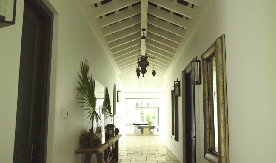The property's architecture emphasizes openness, natural materials, and movement between different living areas. This approach helps distinguish the island retreat from the couple's more conventional Tennessee residences. | Source: YouTube/Architectural Digest