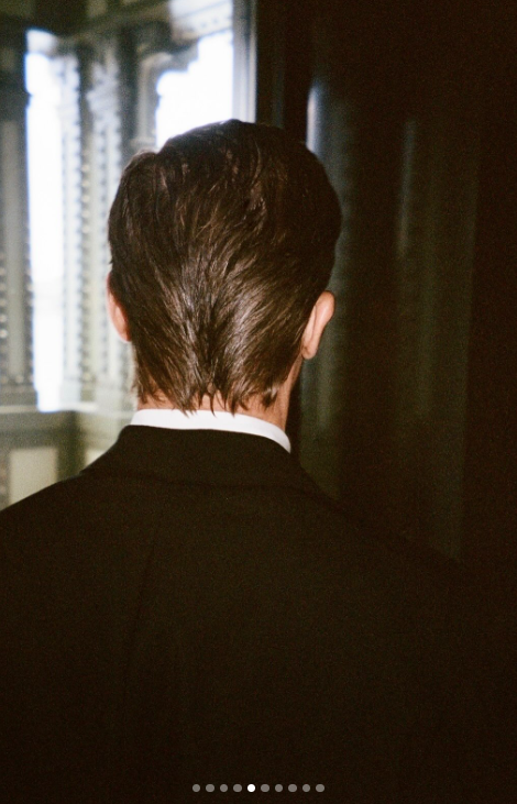 One behind-the-scenes shot turned the camera away from Pitt's face and toward his hair, revealing the slicked-back style from the back. The close-up also captured the neat finish above the collar of his black formalwear. | Source: Instagram/lauriezanoletti