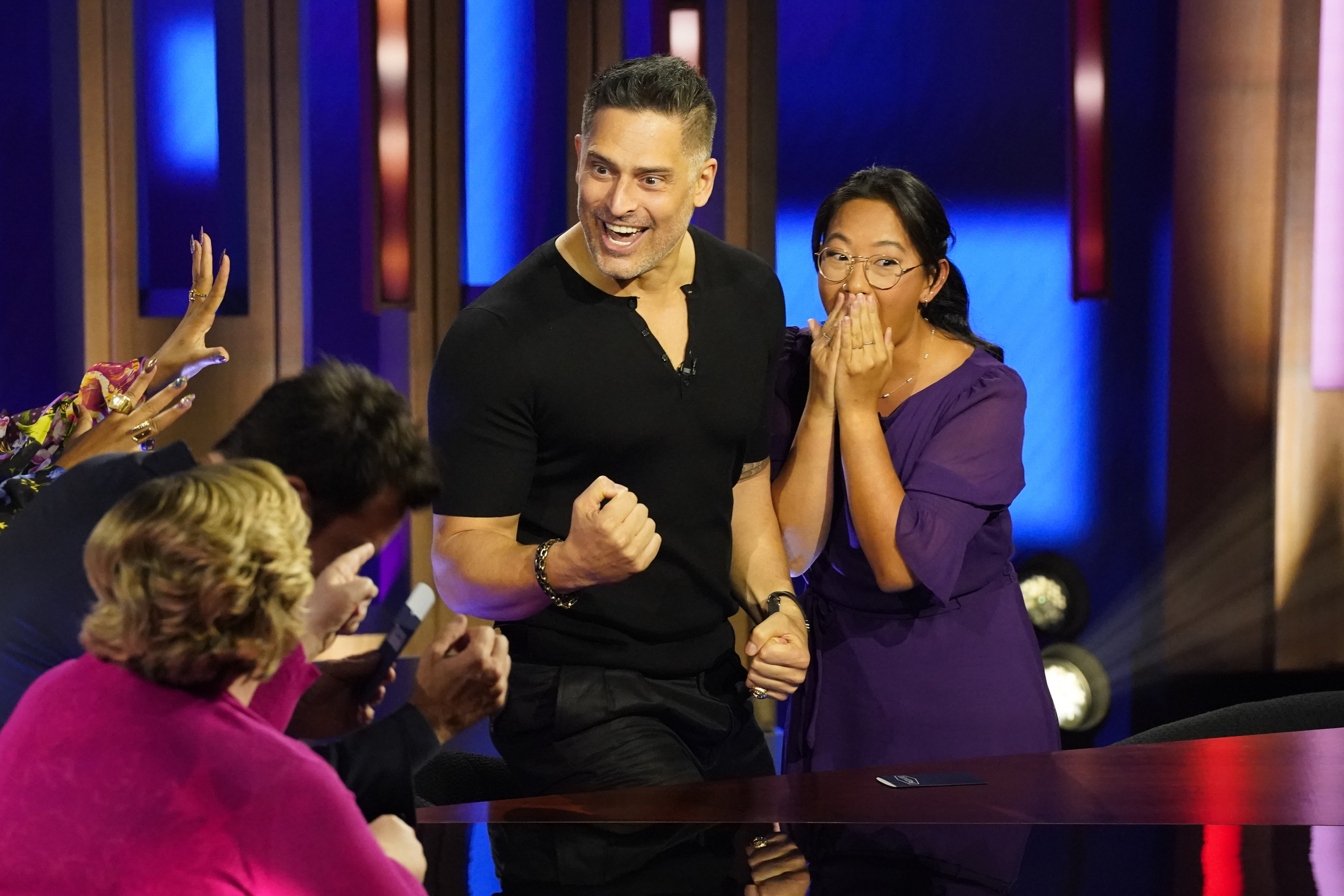 Joe Manganiello celebrates alongside a contestant during an appearance on NBC's "Password." The actor's participation in the game show offered audiences another glimpse of his energetic television presence. | Source: Getty Images