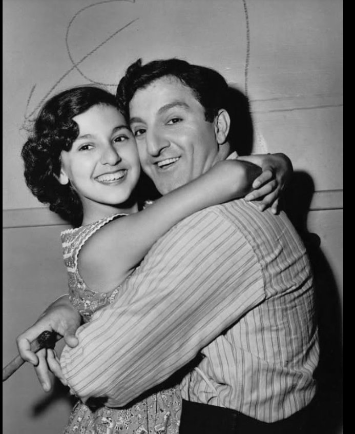 Marlo Thomas embraces her father, Danny Thomas, in a vintage black-and-white portrait from her youth. | Source: Facebook/Classic Movies Digest
