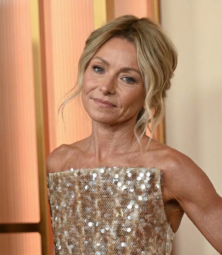 An AI-generated depiction based on a real photograph of Kelly Ripa at the 2026 Oscars imagines the television star with more pronounced facial lines and visible signs of aging, offering a hypothetical glimpse of her appearance without cosmetic enhancements. | Source: Gemini