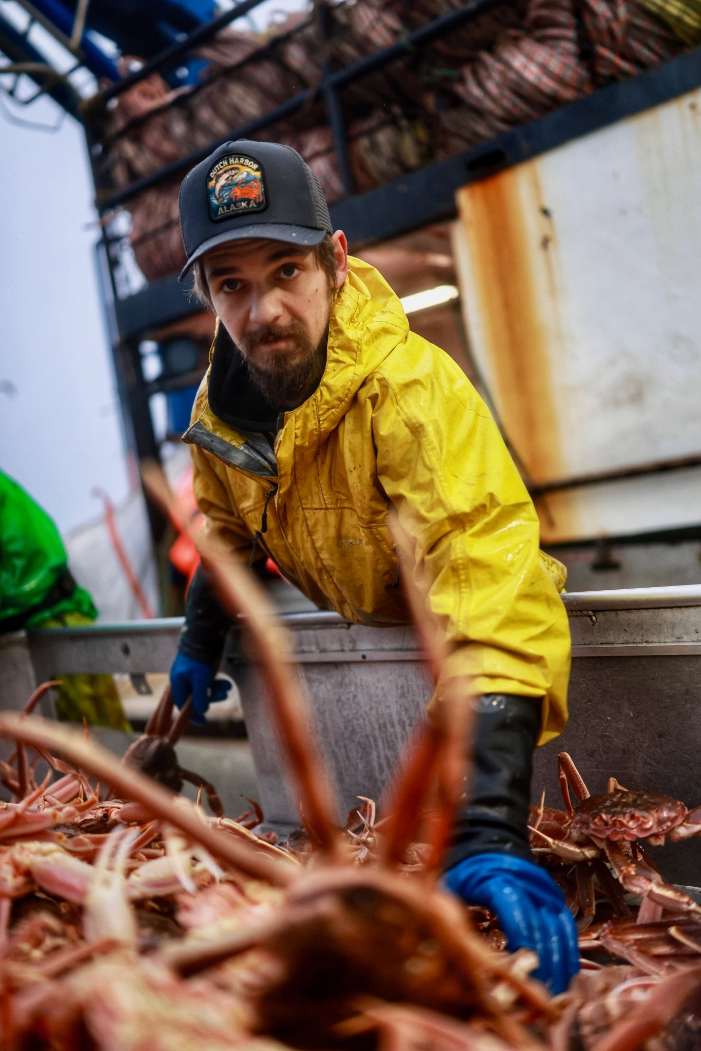 Todd Meadows handling crabs while looking at the camera. | Source: Facebook/CaptainRick Shelford
