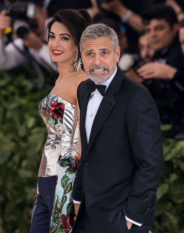 Amal and George Clooney arriving to the Heavenly Bodies: Fashion & The Catholic Imagination Costume Institute Gala on May 5, 2018 in New York City | Source: Getty Images