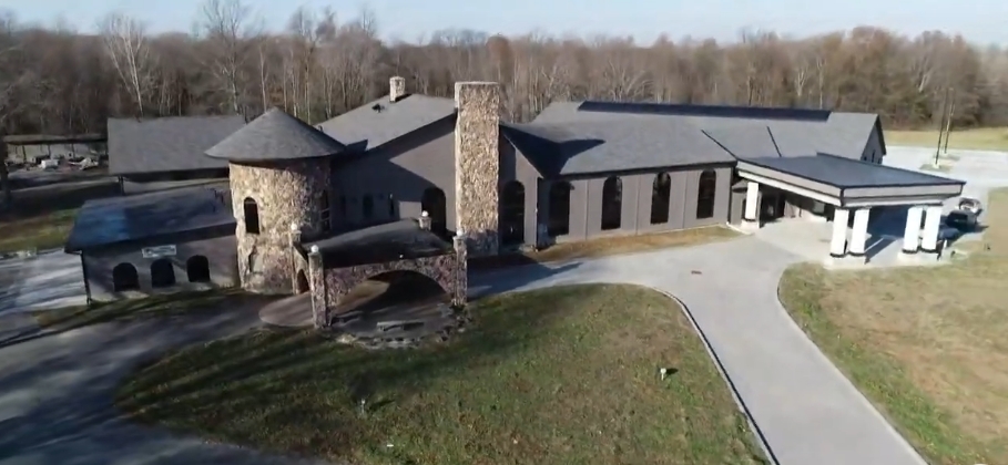 In a video dated November 28, 2019, an aerial view revealed the transformed exterior of Mike Tyson's former Ohio mansion, with its distinctive stone tower and chimney still anchoring the sprawling structure. Renovated grounds, refreshed roofing, and a covered entrance reflected the work undertaken after Living Word Sanctuary Church acquired the once-neglected estate and began converting it into a permanent home for its congregation. | Source: YouTube/WKYC Channel 3