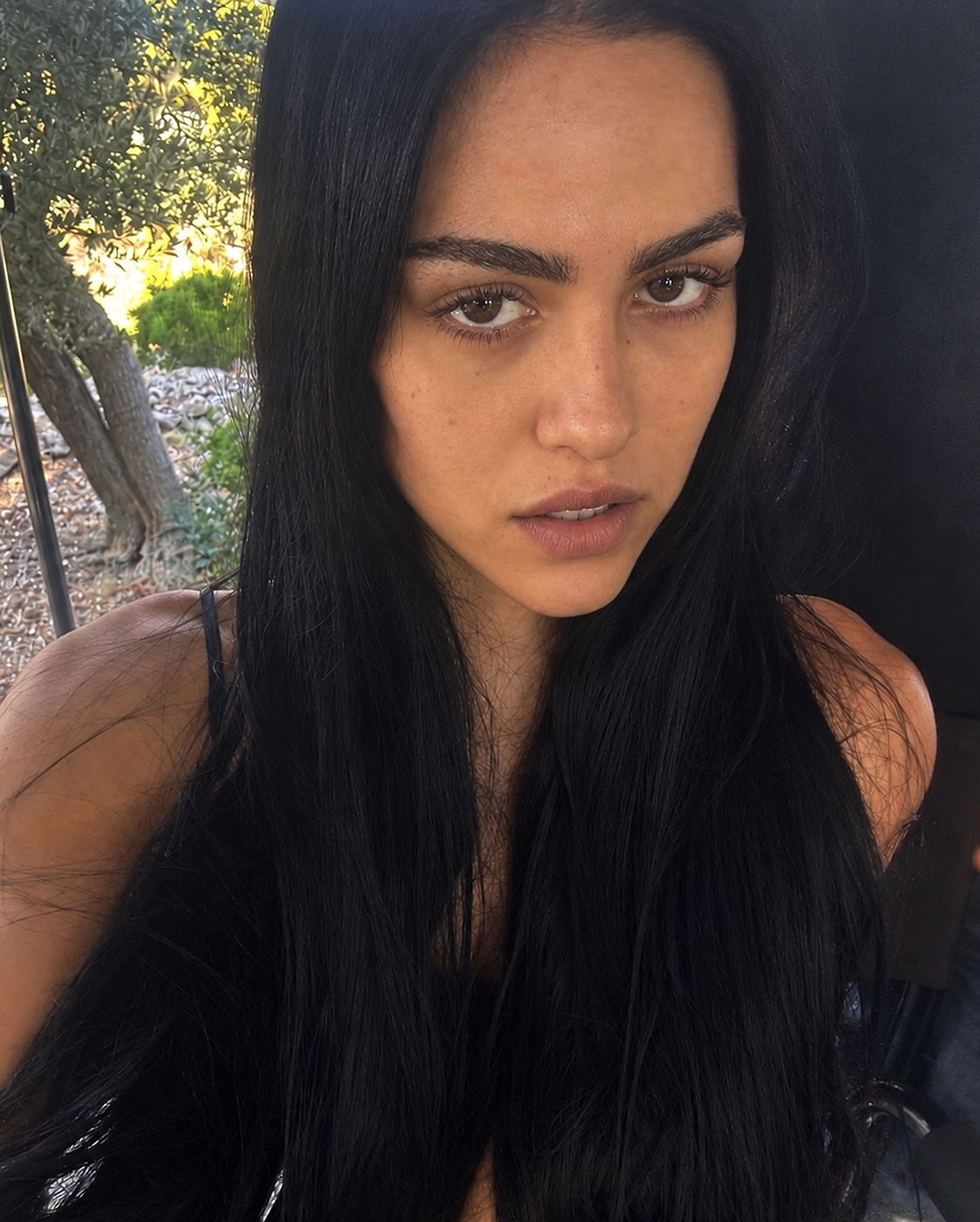 Amelia Gray Hamlin is depicted by AI with long, straight dark hair, defined brows, a softly contoured nose, and natural-looking lips. | Source: ChatGPT