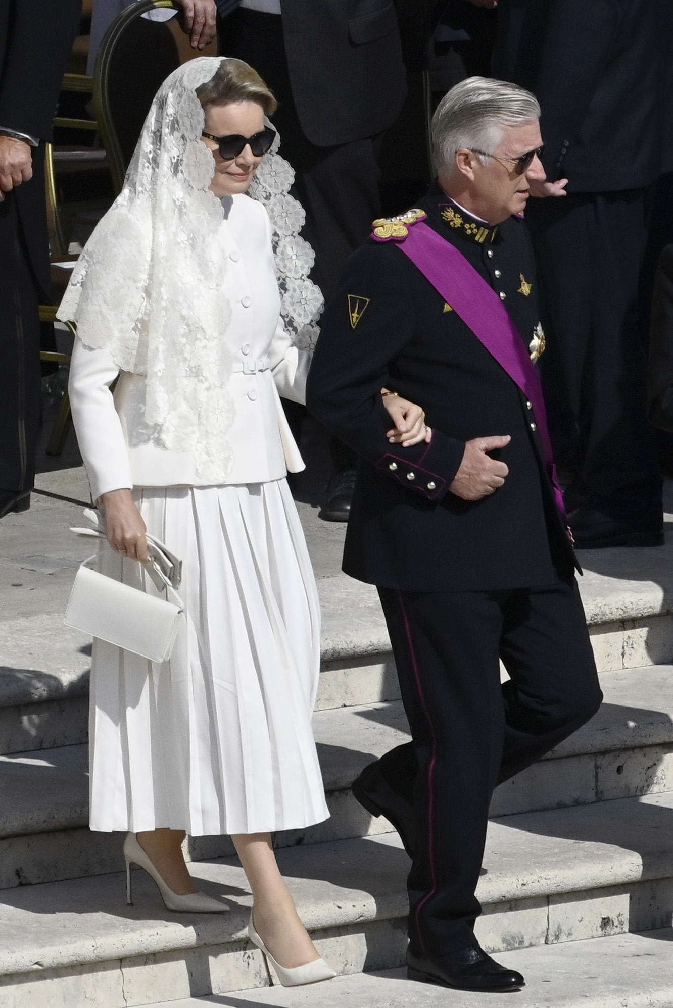King Philippe of Belgium and Queen Mathilde of Belgium attend the Vatican inauguration mass for Pope Leo XIV on May 18, 2025, with Queen Mathilde wearing white and a traditional veil, part of a custom accorded to Catholic queens.