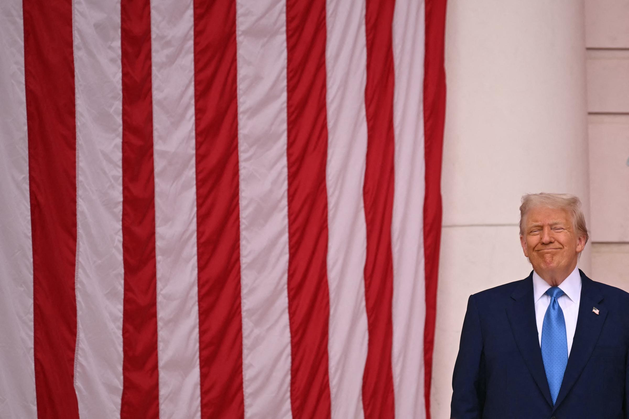 President Donald Trump smiles before speaking in the amphi-theatre in Arlington, Virginia, on Memorial Day, May 26, 2025 | Source: Getty Images