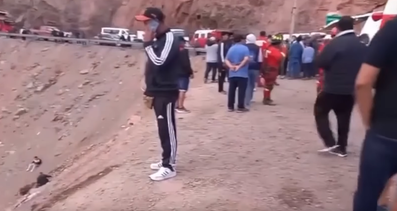 People and first responders gathered on the rough stretch of the Pan-American Highway South in Peru, from a video dated November 12, 2025 | Source: Youtube/NDTV
