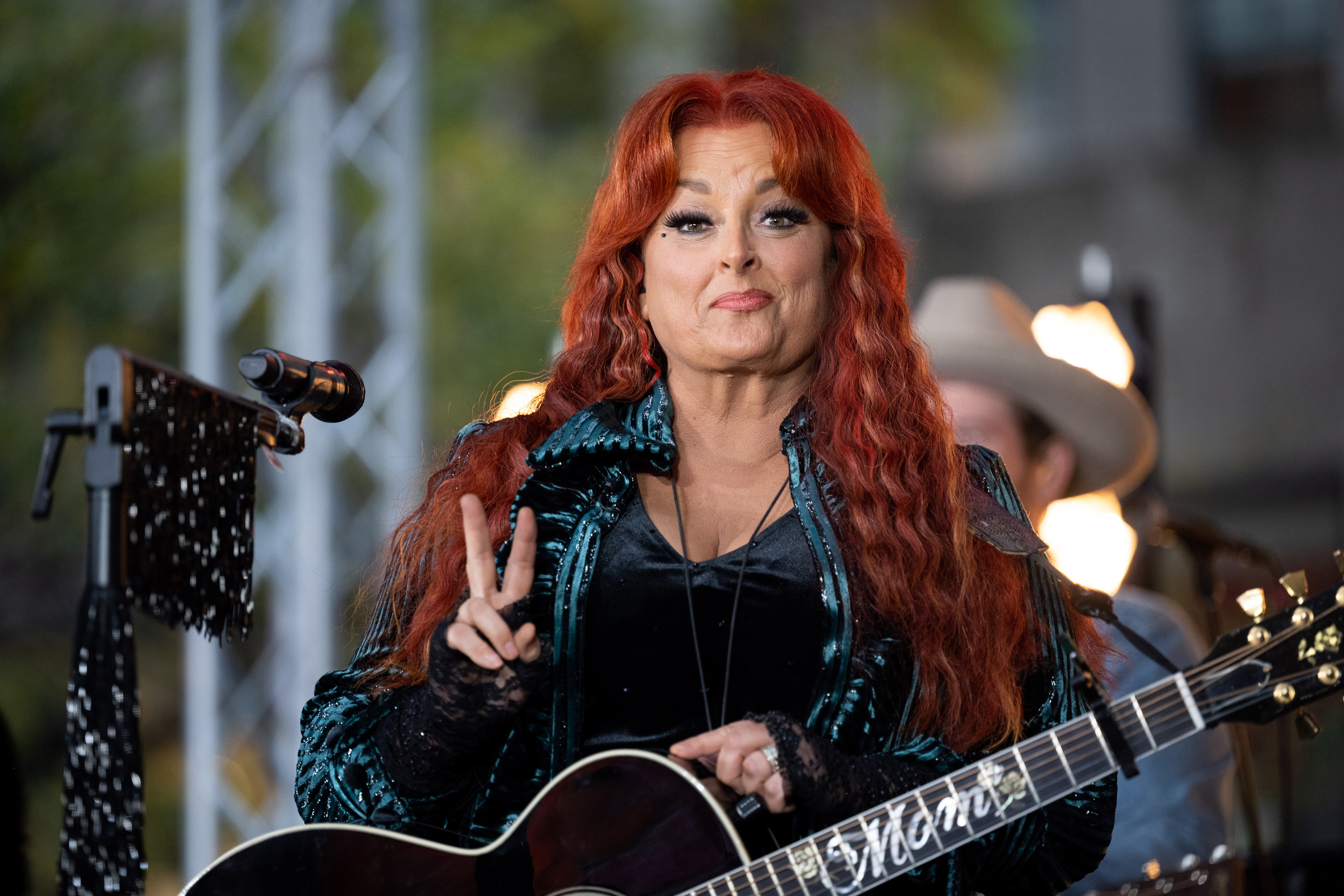 Wynonna Judd appears with her guitar on NBC's "Today" on October 24, 2022. She said losing their mother had brought her and Ashley closer, despite rumors of a family feud. | Source: Getty Images