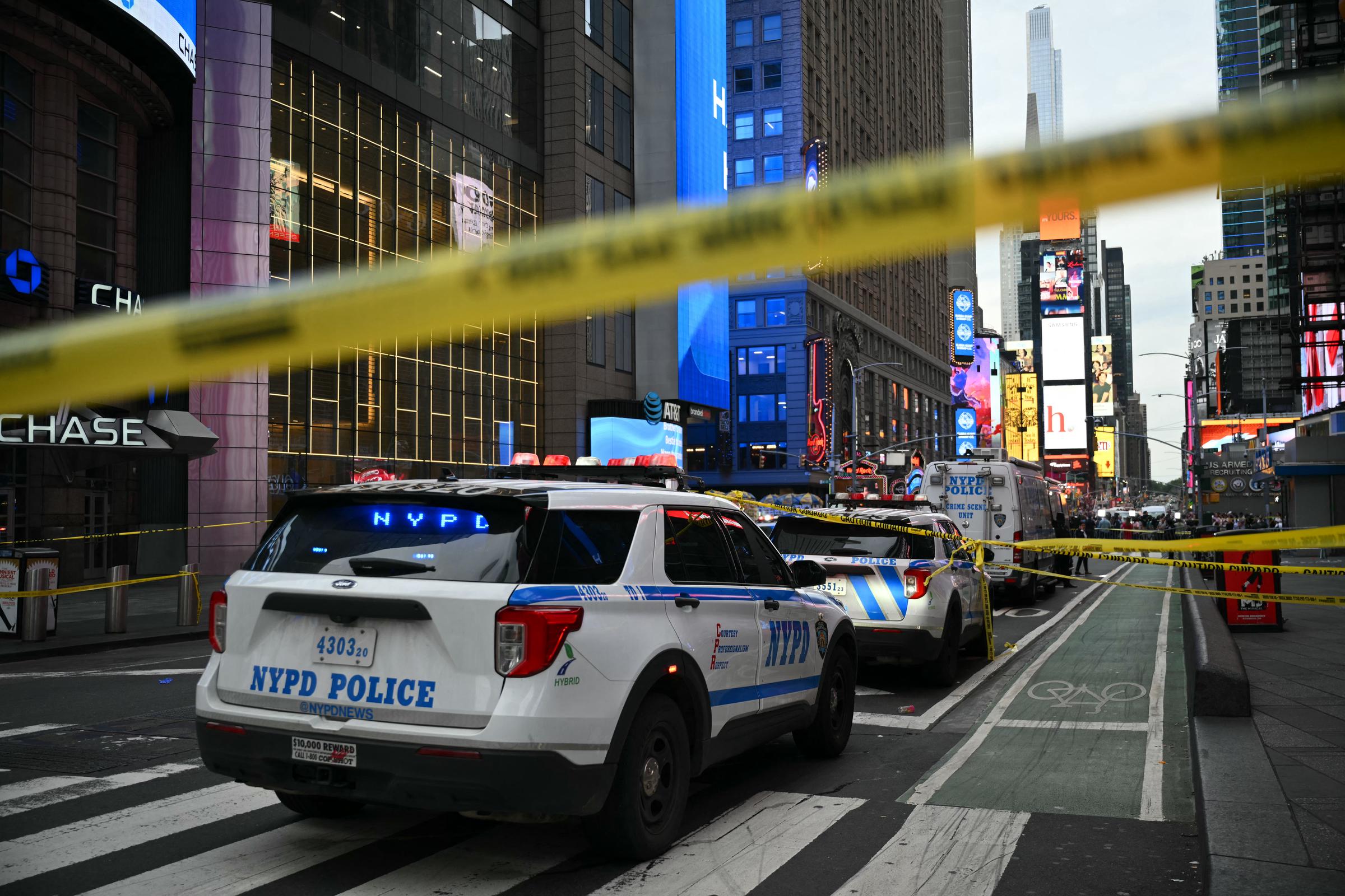 Police vehicles and yellow tape marked off the Times Square area after the August 31 stabbings and police shooting. The scene Patrick Peralta later recognized in news coverage was where his sister's final hours unfolded. | Source: Getty Images