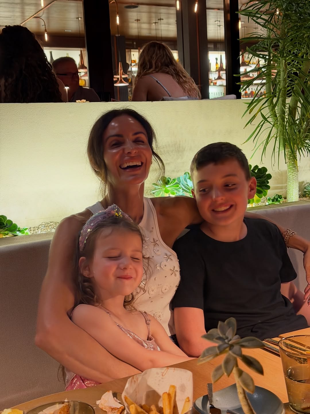 Samantha Busch laughing with her and Kyle Busch's two kids, Lennix and Brexton Busch. | Source: Instagram/samanthabusch and rowdybusch
