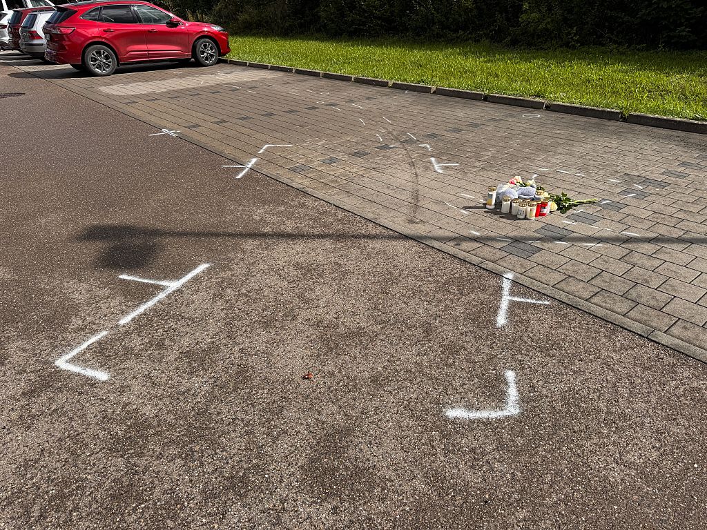 People leave flowers and candles at the site of the incident | Source: Getty Images