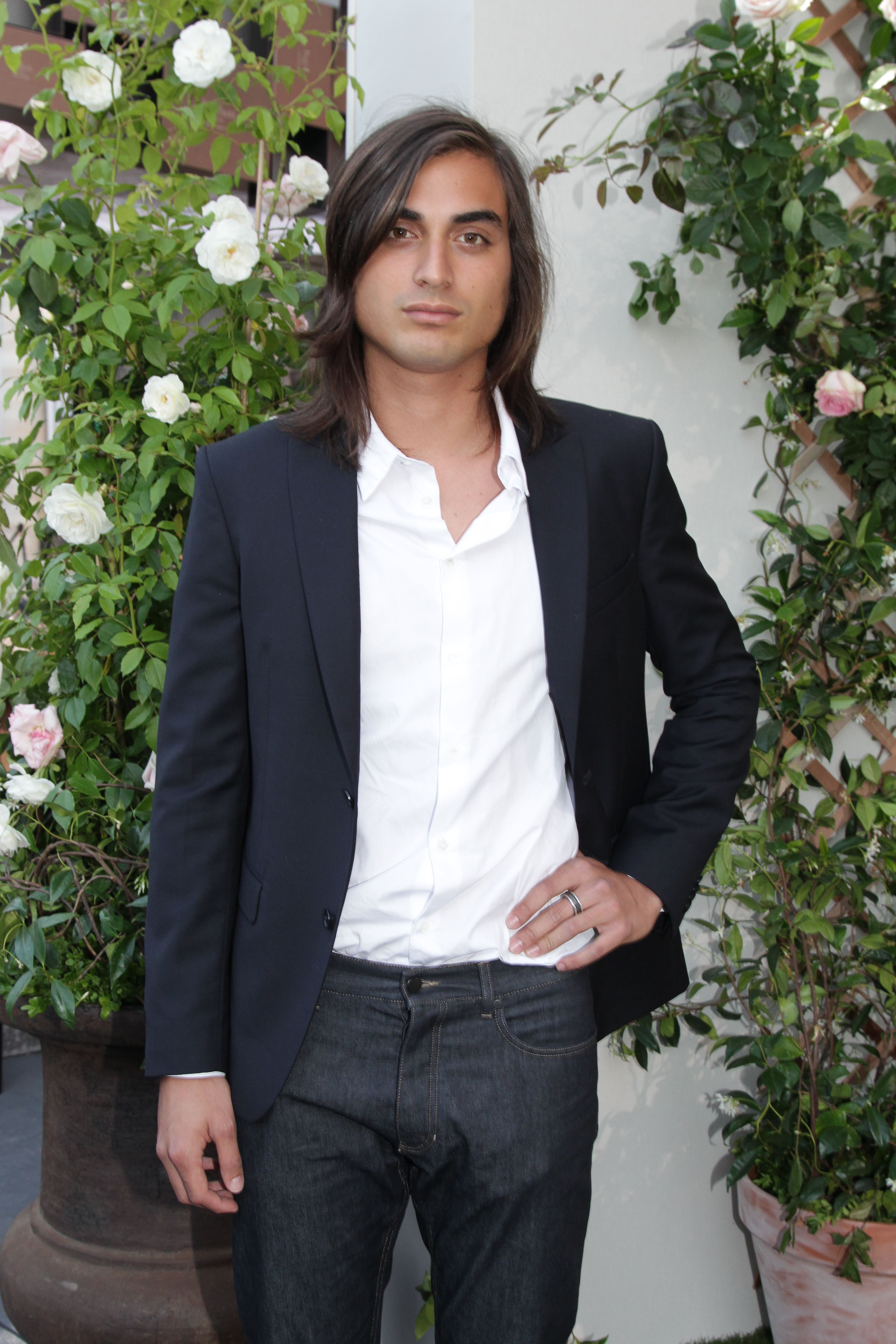 Tuki Brando attends a private dinner celebrating the Berluti Menswear Spring/Summer 2013 show at the Jardin du Palais Royal during Paris Fashion Week in France on June 29, 2012. Raised in French Polynesia, he later established himself internationally while working with several renowned luxury fashion brands.
