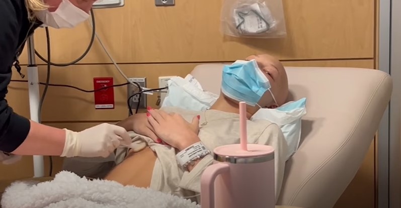 A nurse accesses Isabella Strahan's chemo port during a video wherein Isabella shared that she was experiencing new symptoms. | Source: YouTube/Isabella Strahan