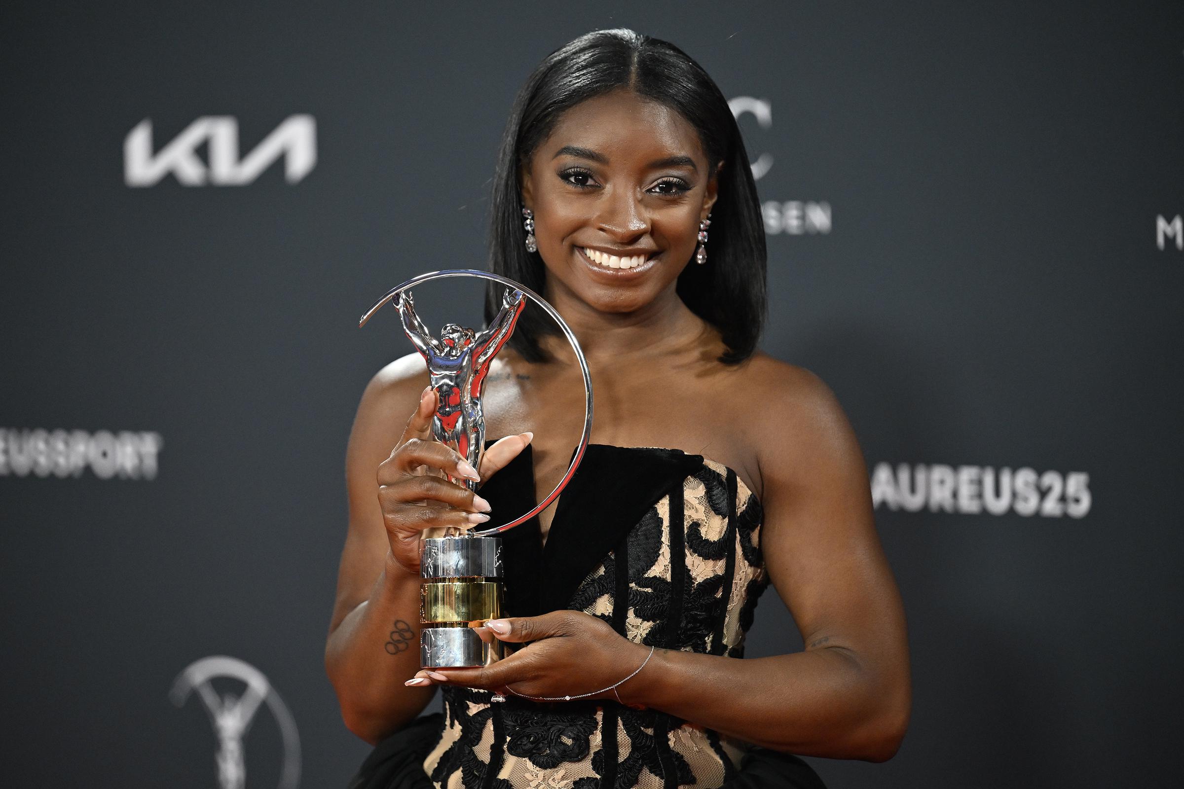 Simone Biles posing with her award for "Best Female Athlete of the Year" during the Laureus World Sports Awards in Madrid, Spain on April 21, 2025. | Source: Getty Images