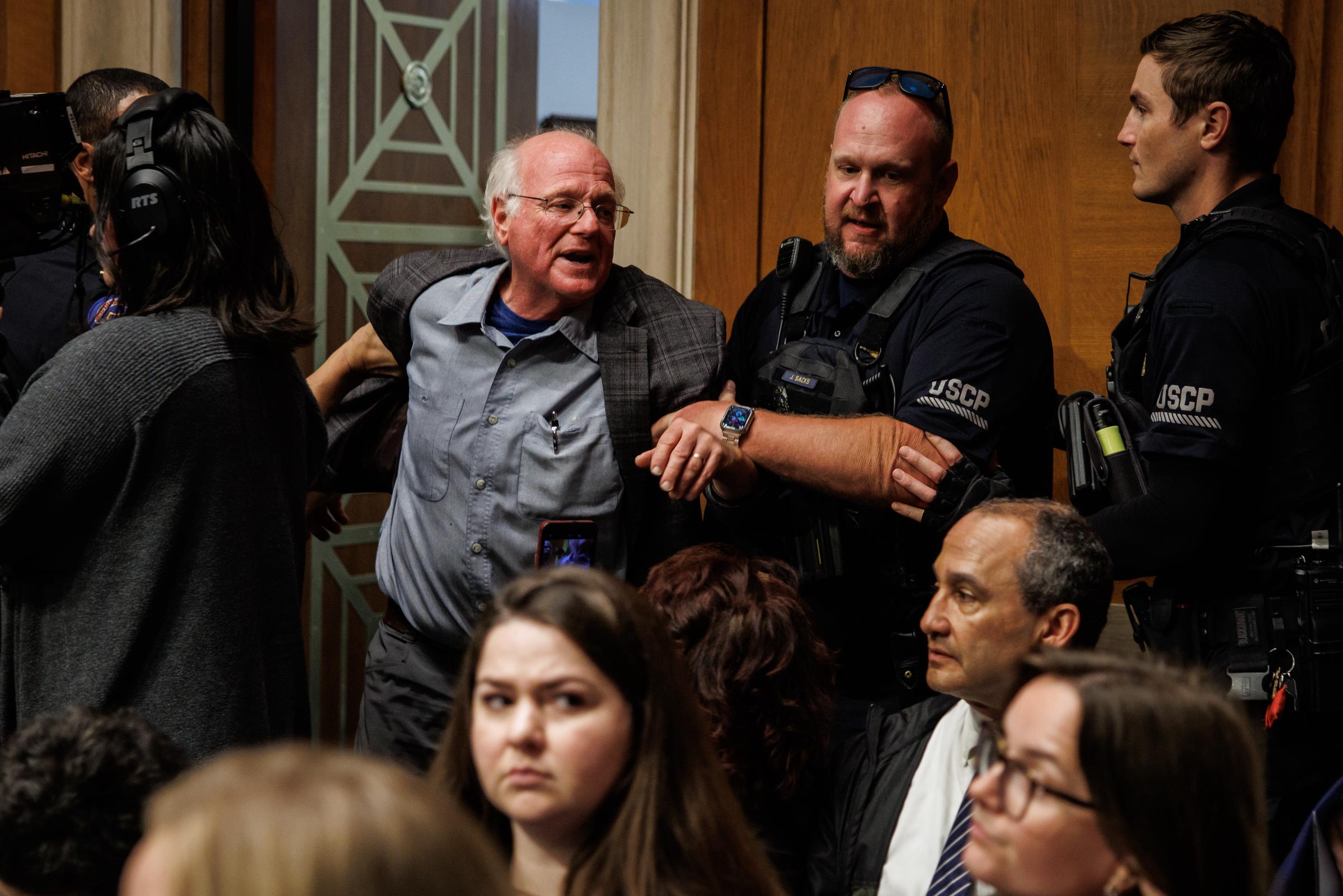 Ben Cohen, co-founder of Ben and Jerry's, is detained by the U.S. Capitol Police for disrupting proceedings during a hearing with Secretary of Health and Human Services Robert F. Kennedy Jr. on May 14, 2025, in Washington, D.C. | Source: Getty Images