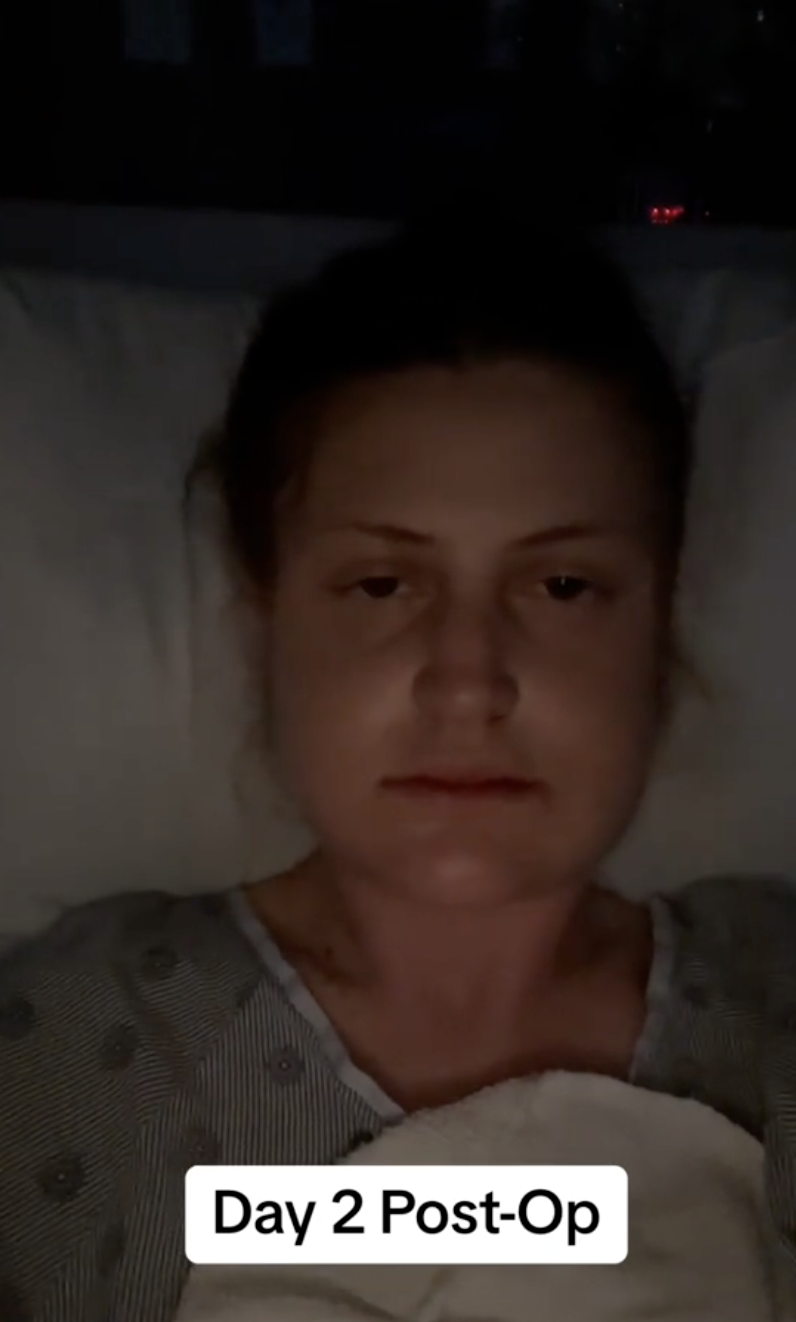 Low lighting captures Virginia Elder resting quietly, her face still swollen on the second day post-surgery. | Source: TikTok/virginiaeelder