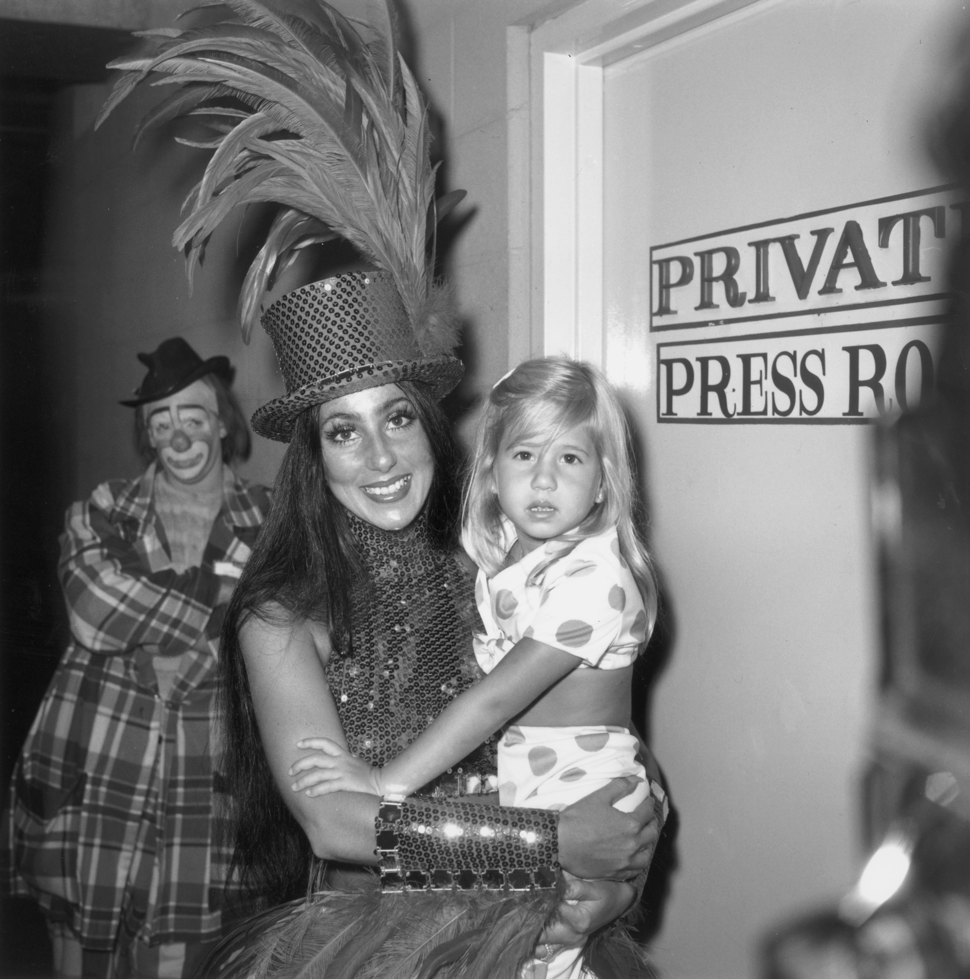 Cher holds her child, Chastity Bono (now Chaz Bono), backstage at the opening day of the Ringling Bros. Circus celebrity benefit for 'Project Hope' in Inglewood, California, in 1974 | Source: Getty Images
