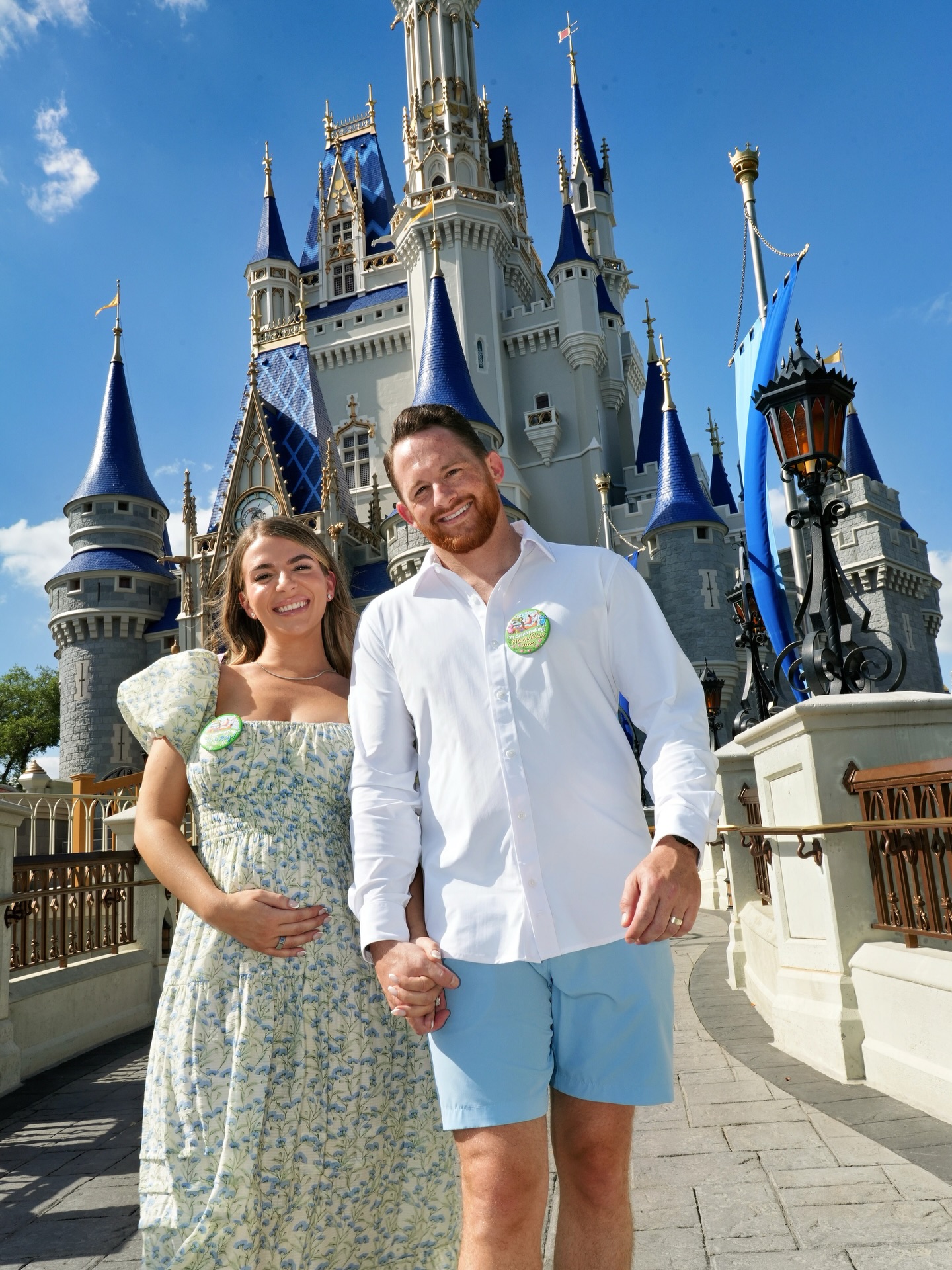 The expectant parents hold hands in front of Cinderella Castle while celebrating the upcoming arrival of Baby Blackstock. | Source: Instagram/rissablackstock