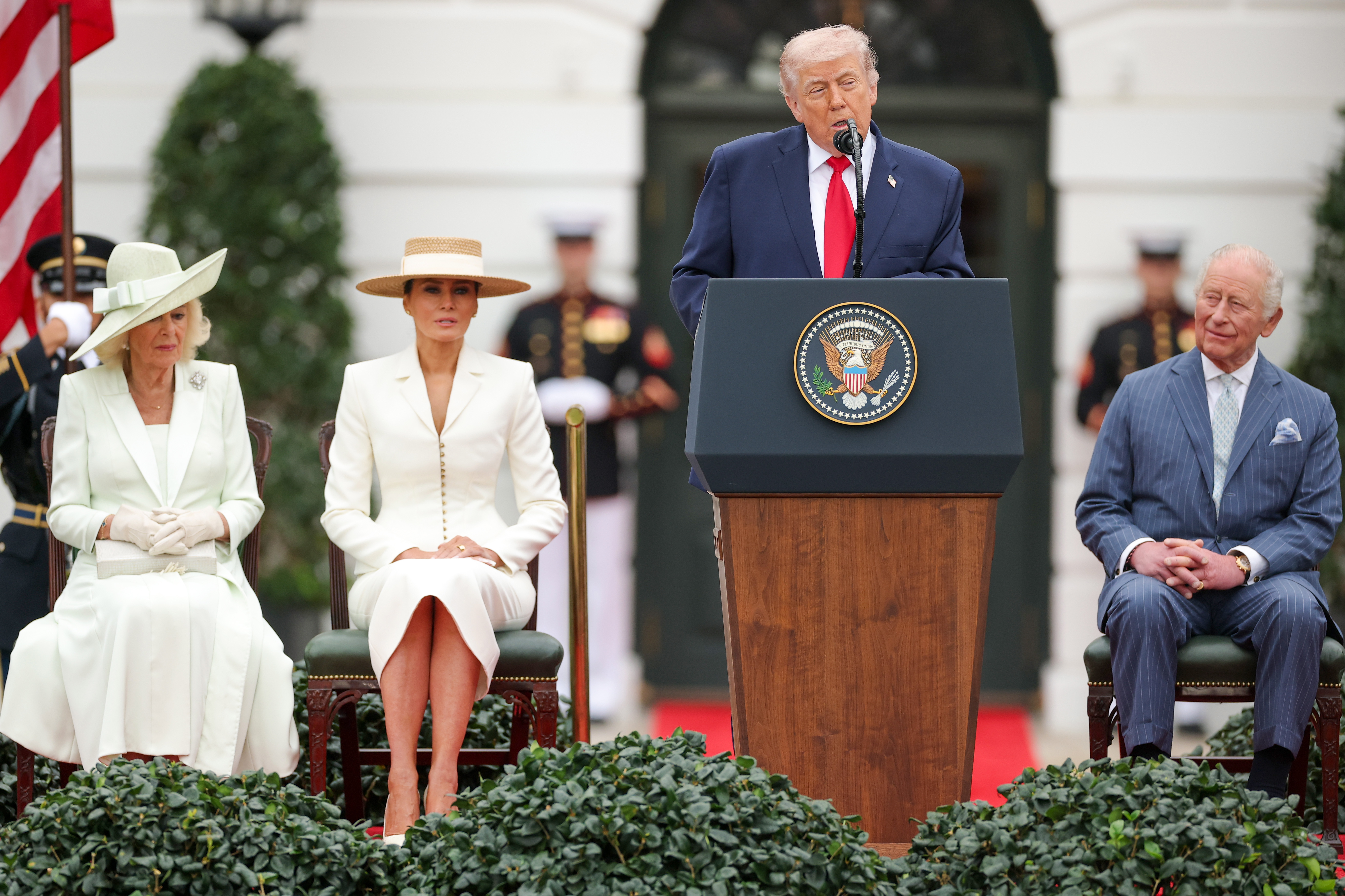 Donald Trump speaks onstage as Queen Camilla, Melania, and King Charles III listen on April 28, 2026 | Source: Getty Images