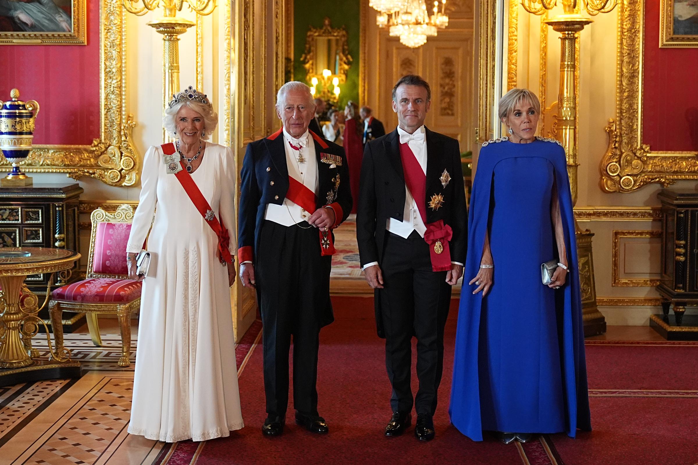 Queen Camilla, King Charles III, Emmanuel and Brigitte Macron posing for a photo at the state banquet hosted for the French couple's visit in Windsor, England on July 8, 2025. | Source: Getty Images