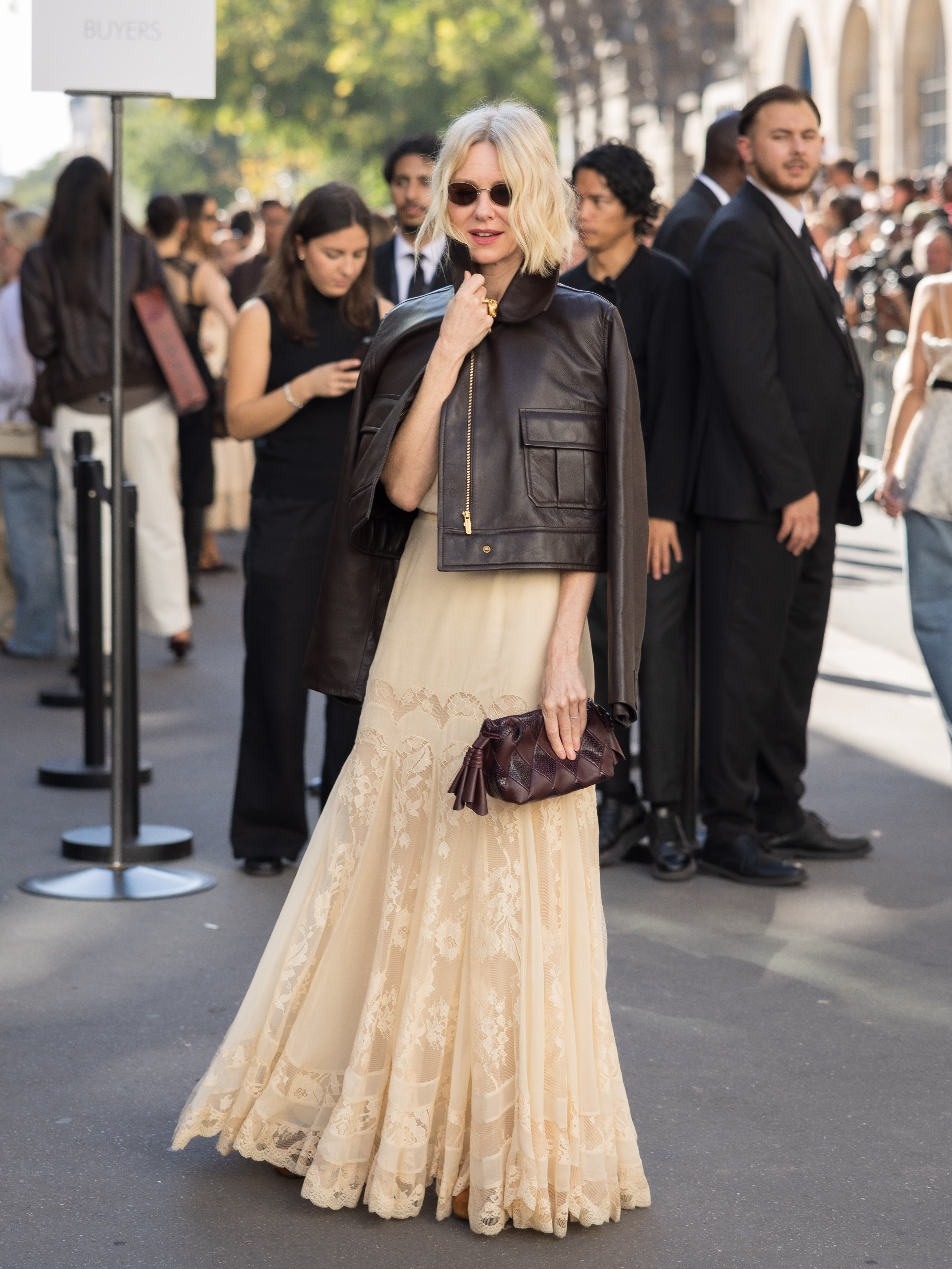 Lace and leather pull in opposite directions in Naomi Watts' outfit, giving the delicate floor-length dress a tougher layer on top. The actress chose the contrasting combination for Zimmermann's Spring/Summer 2027 presentation during Paris Fashion Week.
