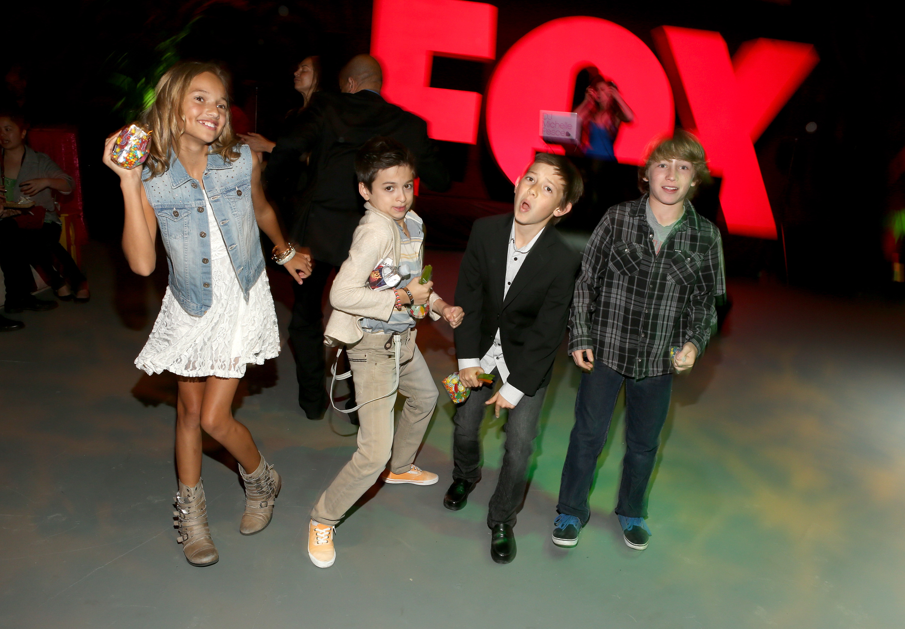 The young performer poses alongside fellow actors Kennedy Waite, Griffin Gluck, and Cooper Roth at the 2013 LA Screenings Lot Party hosted by Twentieth Century Fox Television Distribution in Los Angeles, California. | Source: Getty Images
