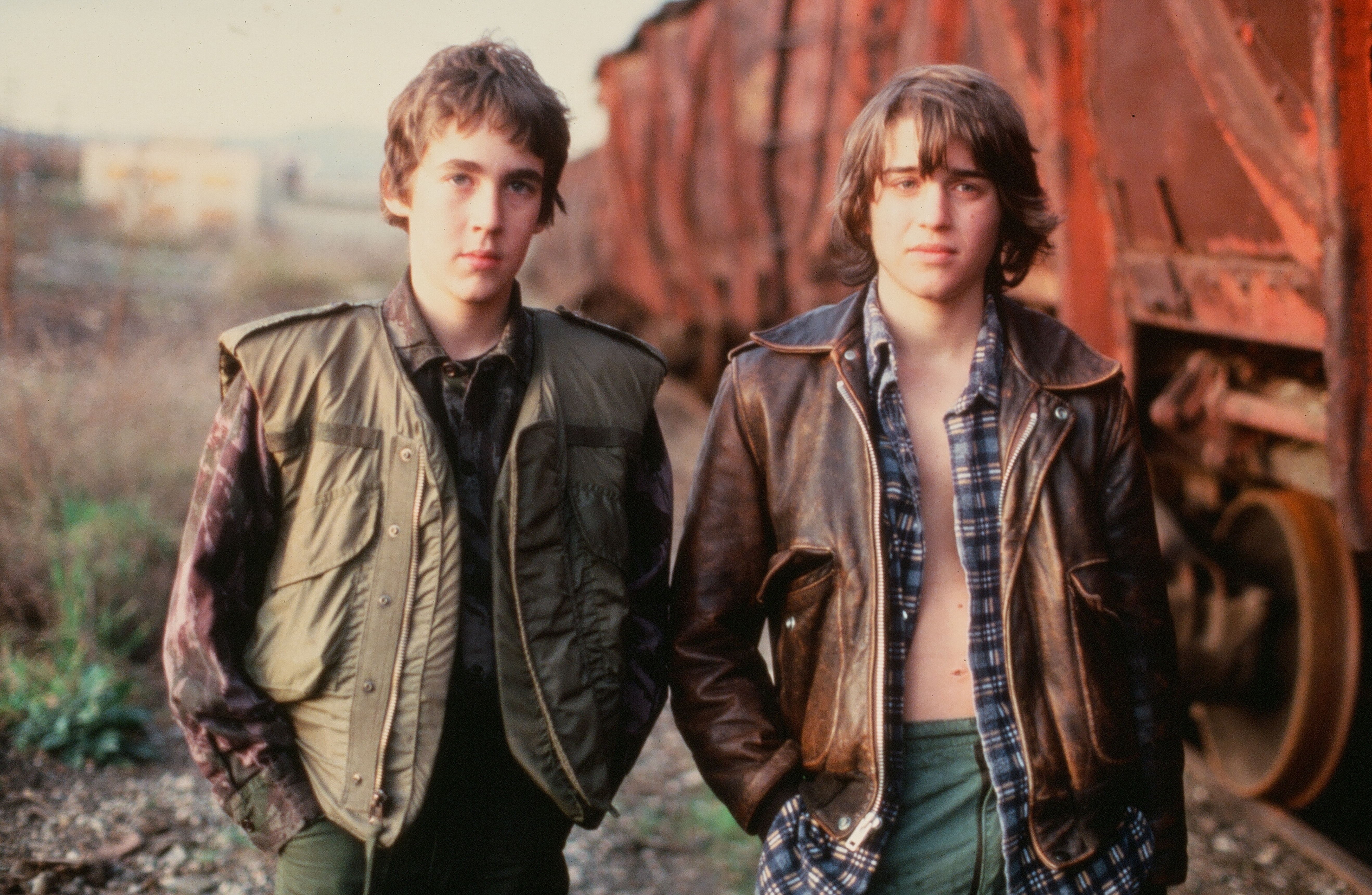 Brin Berliner and Ilan Mitchell-Smith walked along the train tracks in a scene for the Universal Studios movie "The Wild Life." In this photo, they filmed a scene for "The Wild Life" circa 1984. | Source: Getty Images