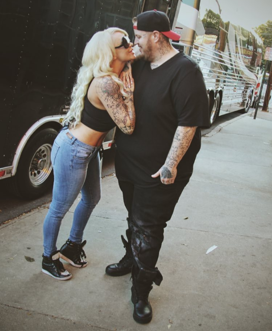 She did not see him as a love interest when they first met. In this photo, they posed next to a tour bus on October 16, 2016. | Source: Instagram/xomgitsbunnie