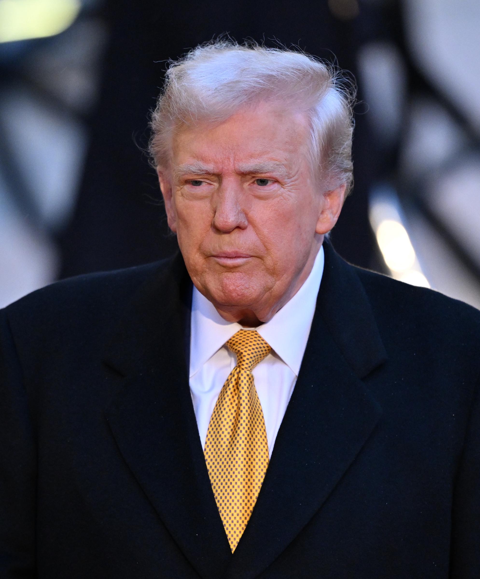 Donald Trump's hair appears at its lightest yet, with a pale blond shade and visible gray, as he arrives at the Elysee Palace in Paris on December 7, 2024.