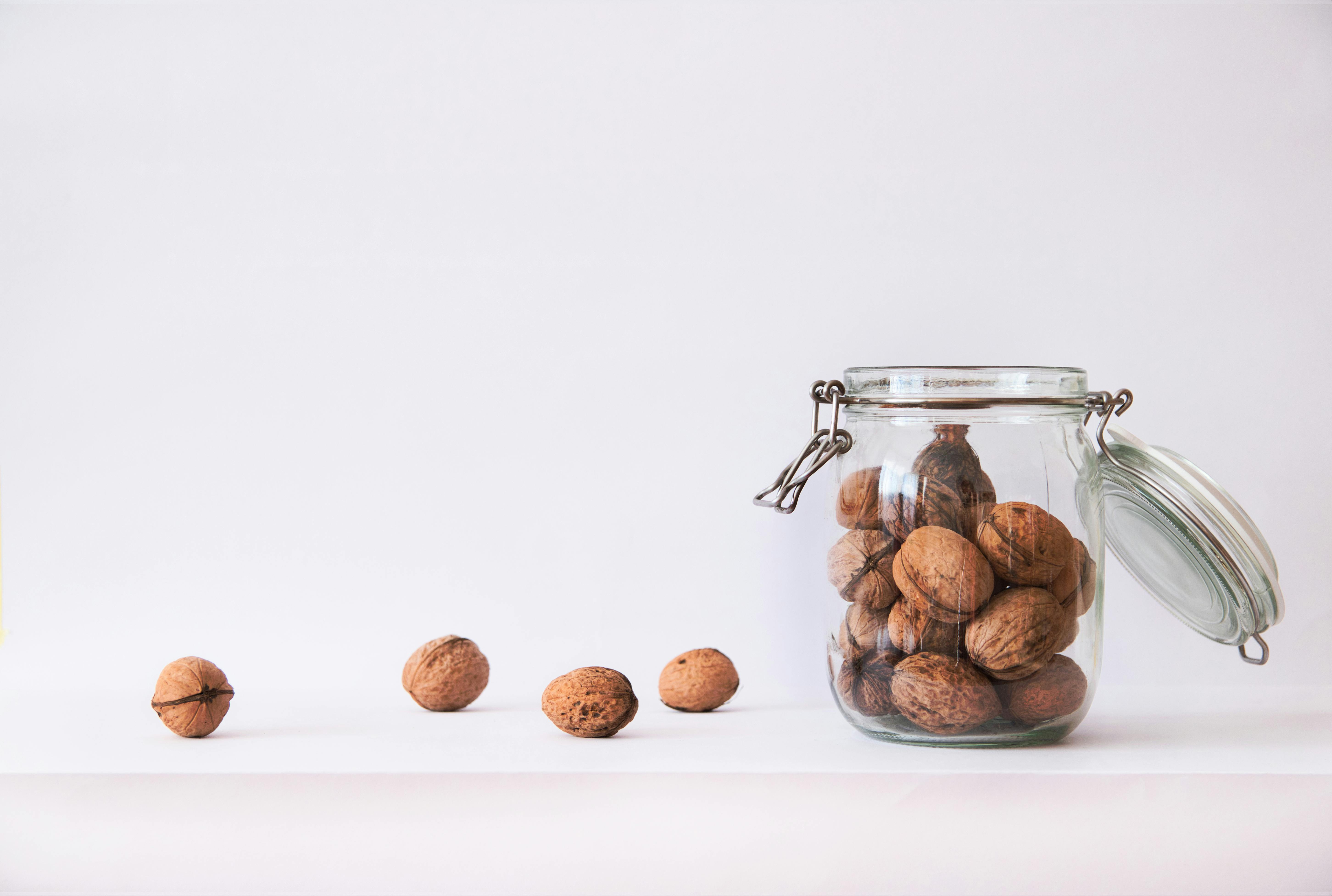 Walnut in a glass jar | Source: Pexels