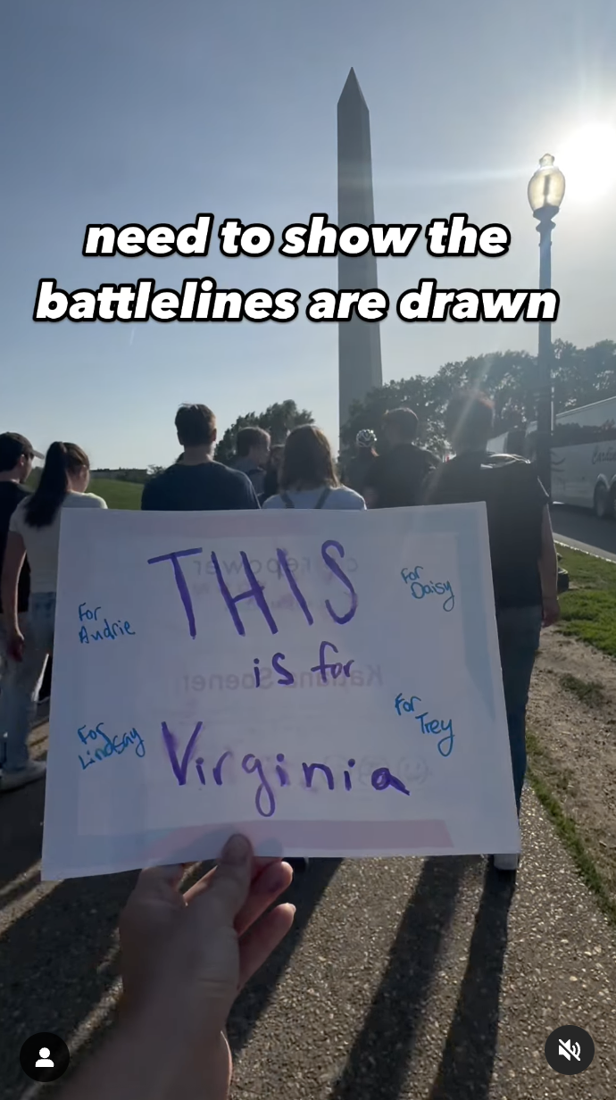 A closeup shot of a person holding a piece of paper during the Denim Day March to support Virginia Giuffre and other abuse victims, as seen in a video dated April 30, 2025 | Source: Instagram/likesummerwillis