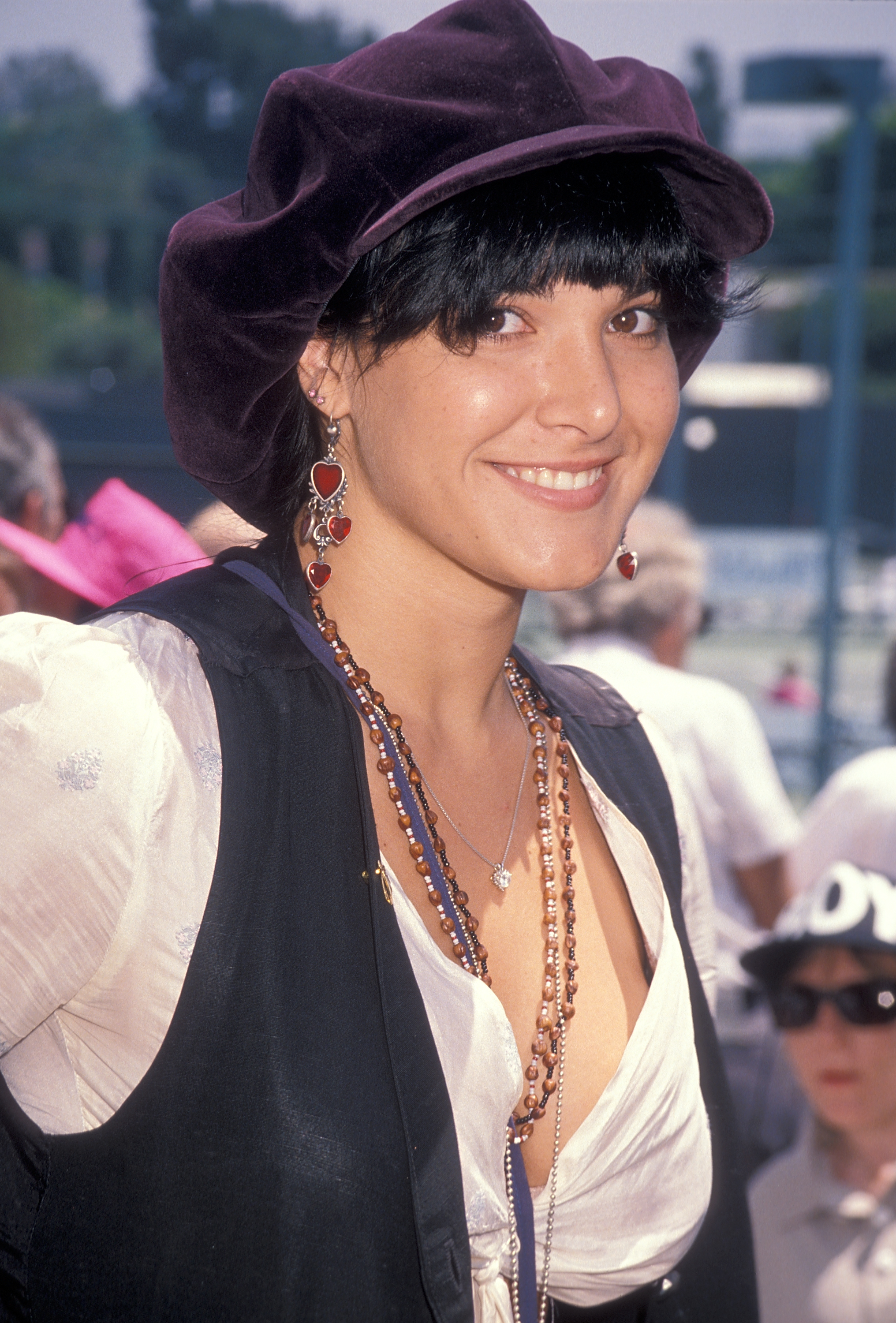 Some hairstyles made her almost unrecognizable, especially as she stepped away from acting to pursue a career in music. In this photo, she attended the Sixth Annual Celebrity Tennis Classic to Benefit the Make-A-Wish Foundation at the Beverly Hills Country Club on August 11, 1990, in West Los Angeles, California. | Source: Getty Images