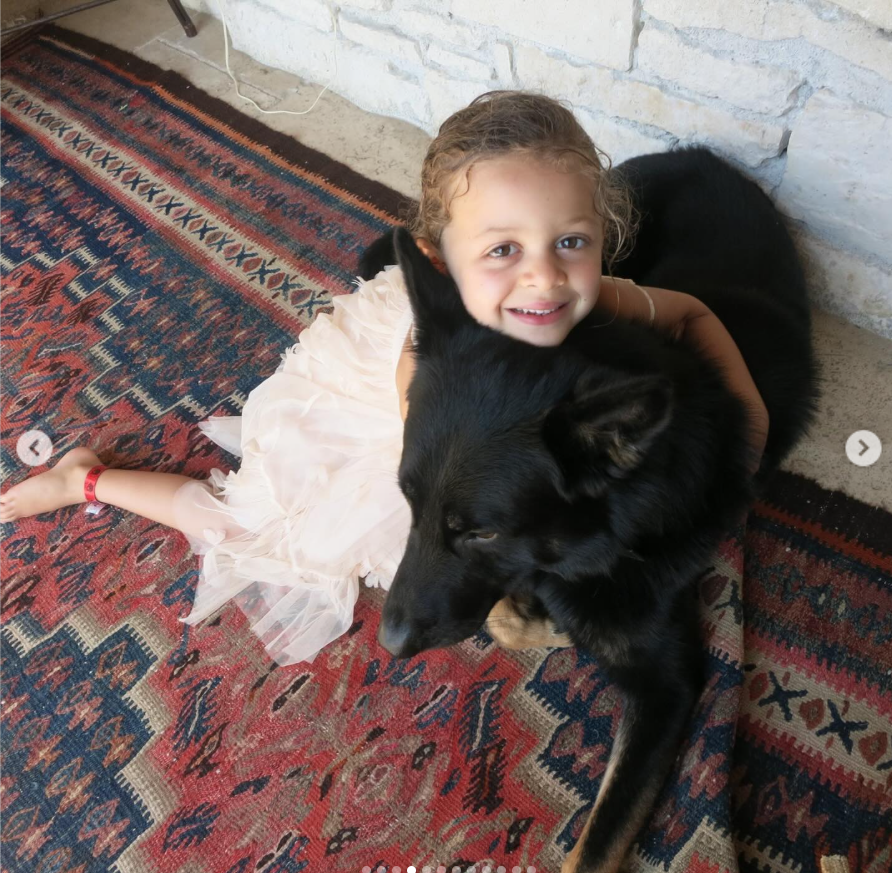 A young Harlow Madden plays with a dog, from a post dated January 12, 2026. | Source: Instagram/nicolerichie