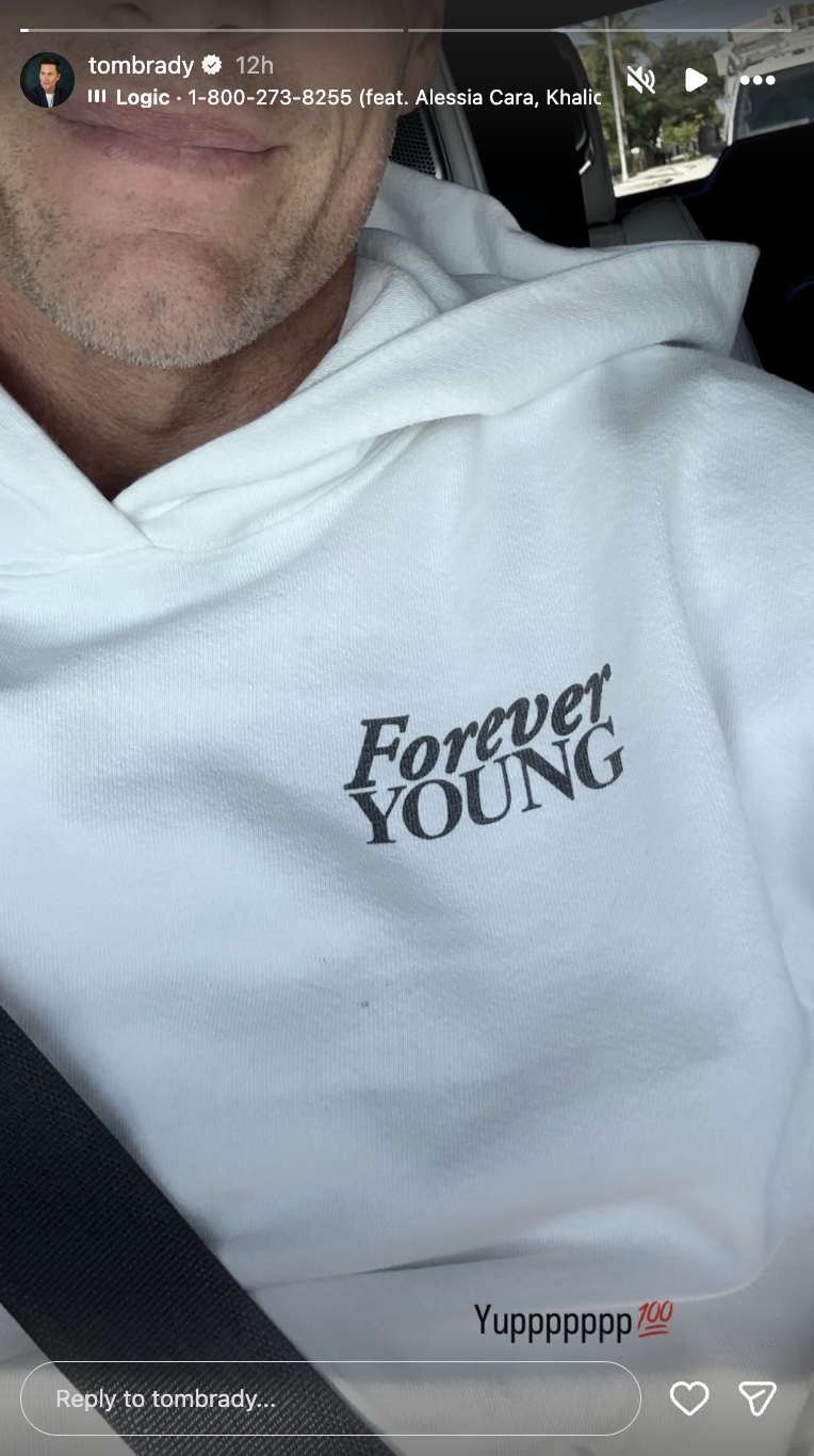 Tom Brady shared a selfie wearing a hoodie with the phrase “Forever Young,” accompanied by a song | Source: Instagram/tombrady