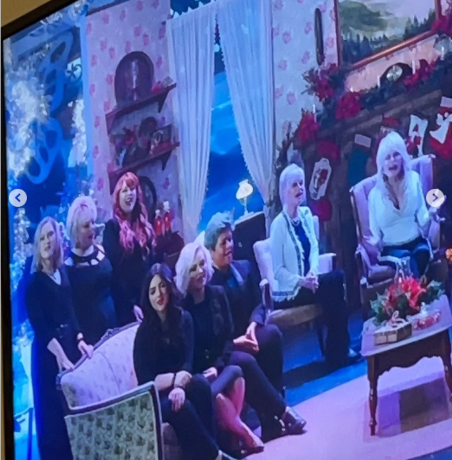 Dolly Parton appears alongside fellow performers in a scene from one of the projects she shared with her great-niece Lainey Mae Parton, whose memories of those experiences have taken on new meaning following her grandmother's death. | Source: Instagram/thelaineyparton