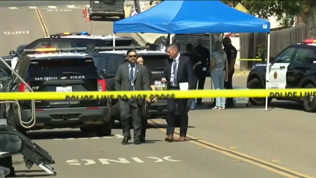 Investigators work behind police tape near the Voight family's San Carlos home following the discovery of three family members dead inside. | Source: YouTube/FOX 5 San Diego