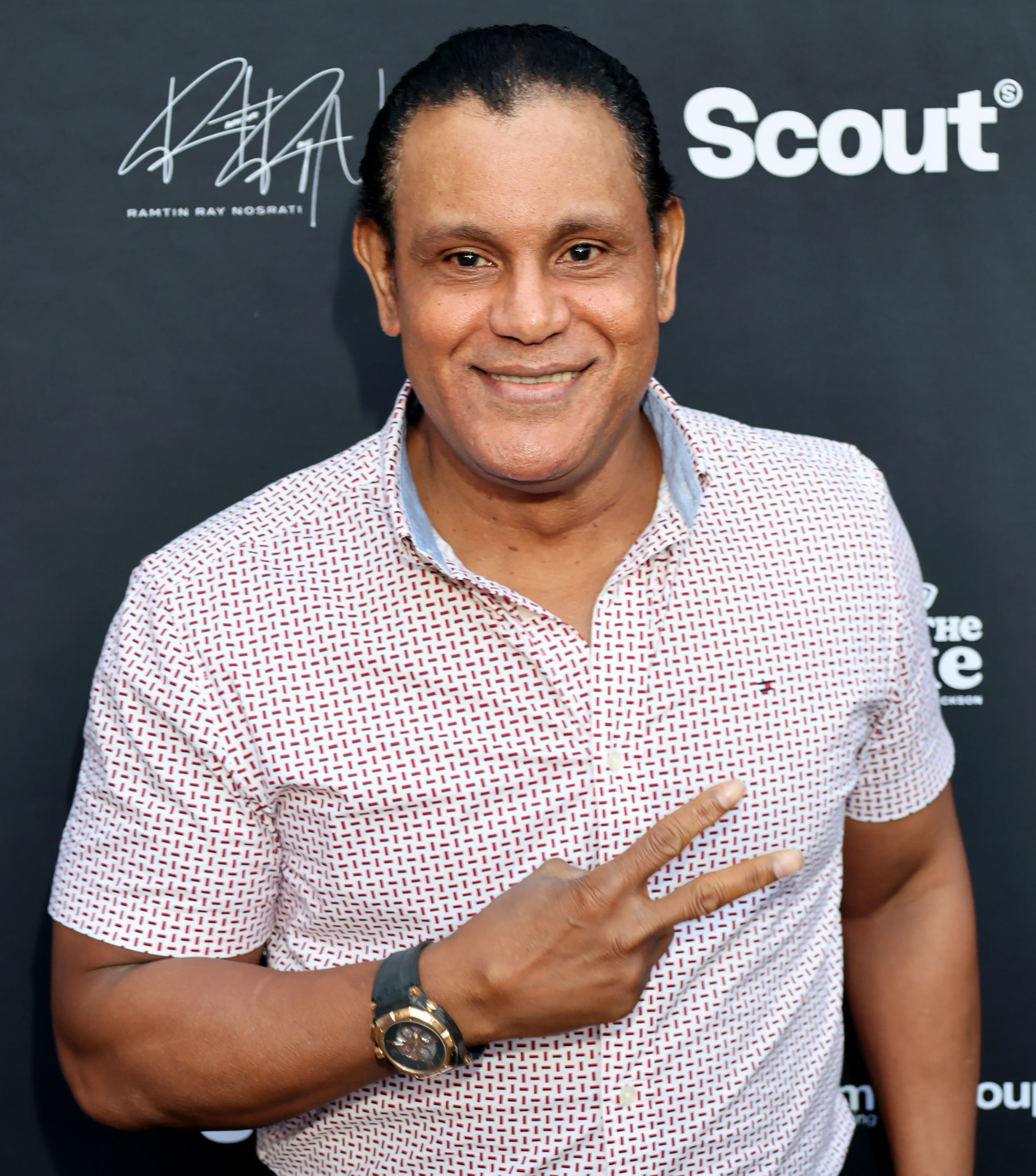 Sammy Sosa flashed a peace sign while attending The Pump Group VIP Summer Soiree 2025 at The Beverly Hilton in Beverly Hills, California, on August 14. Wearing a patterned short-sleeved shirt and wristwatch, the retired MLB star smiled for cameras at the event, nearly two decades after his final season in professional baseball and months after taking steps toward repairing his long-strained relationship with the Chicago Cubs organization and fans.