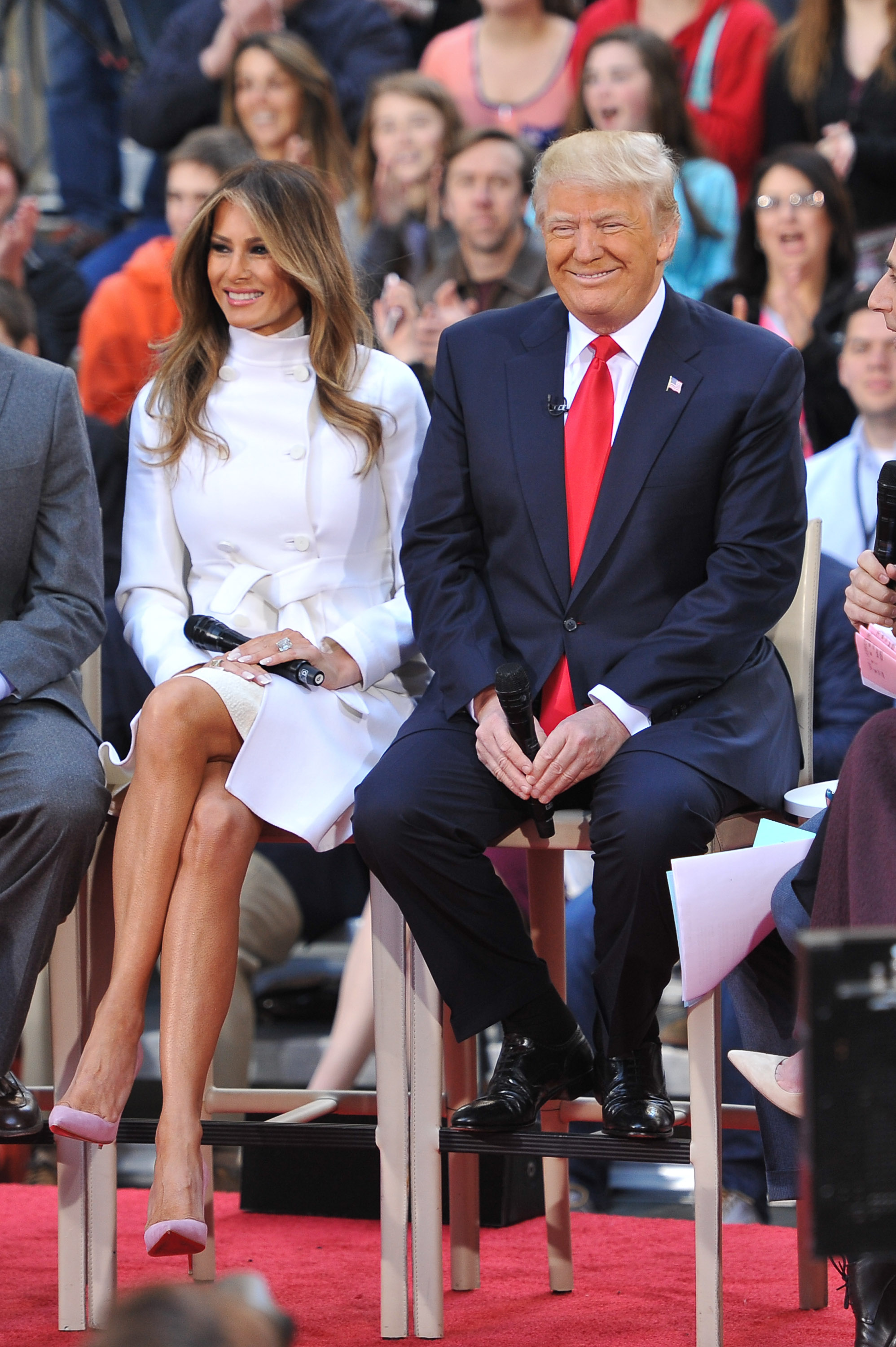 Melania Trump attends NBC’s Today Trump Town Hall at Rockefeller Plaza in New York City on April 21, 2016, wearing a belted, double-breasted white coat over an ivory turtleneck, accented with blush-pink suede pointed-toe pumps that add a gentle pastel finish on towering stiletto heels.