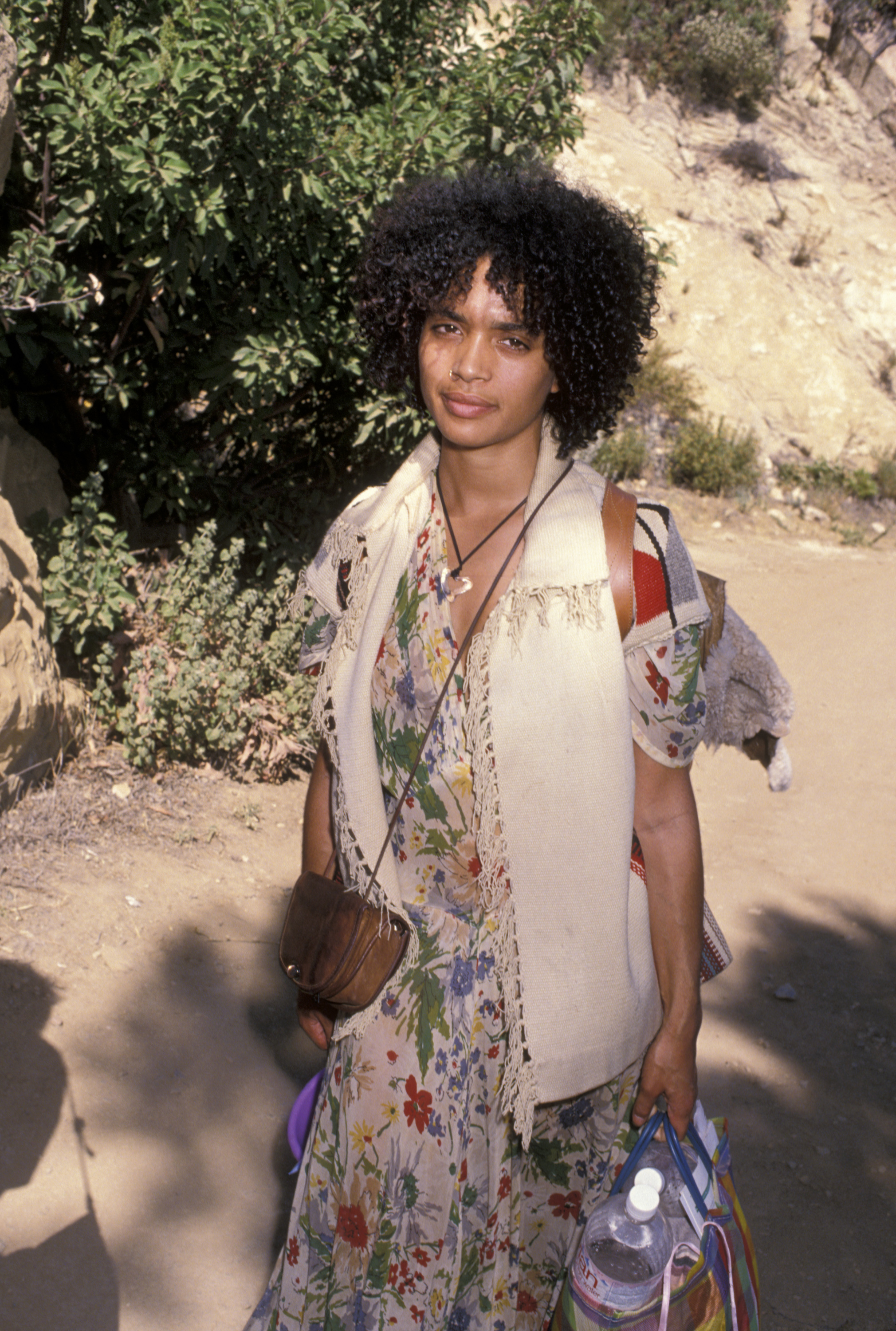 Lisa Bonet attends the Earth Communication Conference in Malibu, embracing a relaxed bohemian style with natural curls, layered pieces, and a calm outdoor setting.