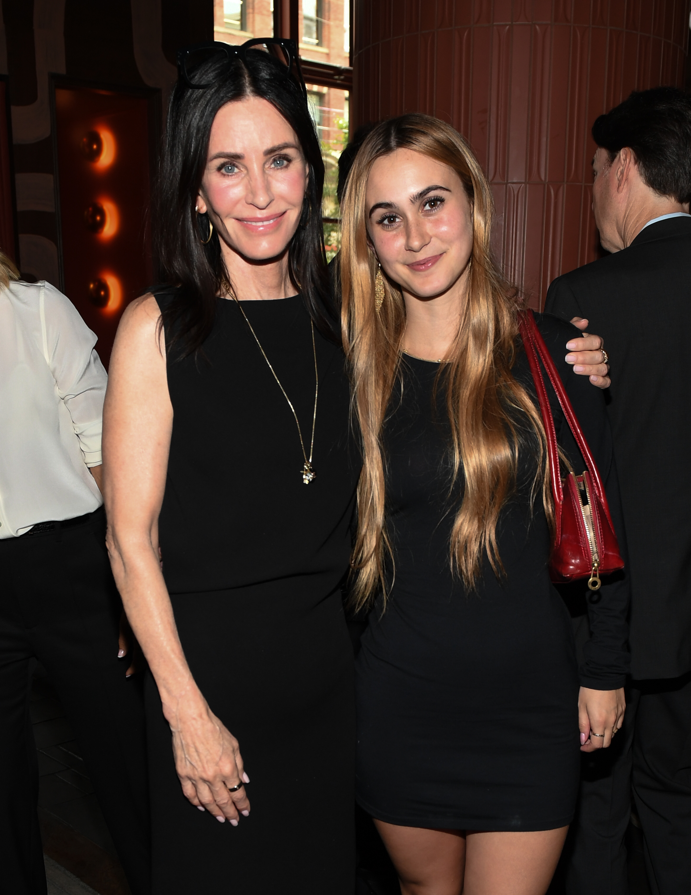 Courtney and Coco strike a relaxed pose together, with Coco’s red shoulder bag providing the only pop of color against their all-black looks. The moment comes after Coco had already made a solo appearance at NYFW just days earlier, where her look sparked a fresh debate about which side of her family she resembles most. | Source: Getty Images