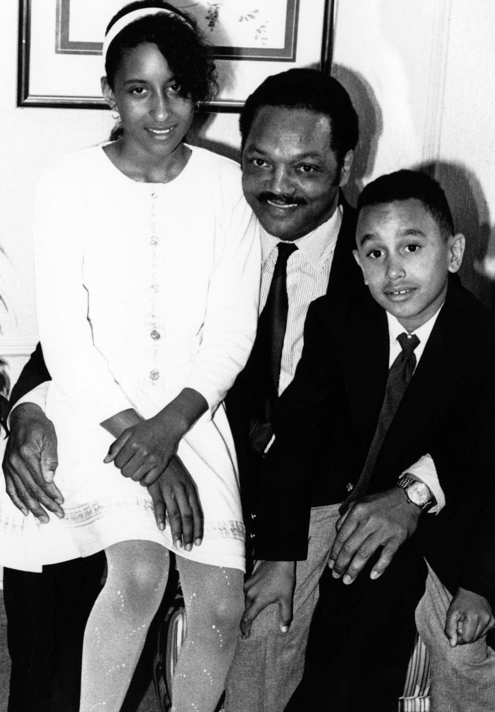 Jesse Jackson sits with children for a photograph, circa 1991 | Source: Getty Images
