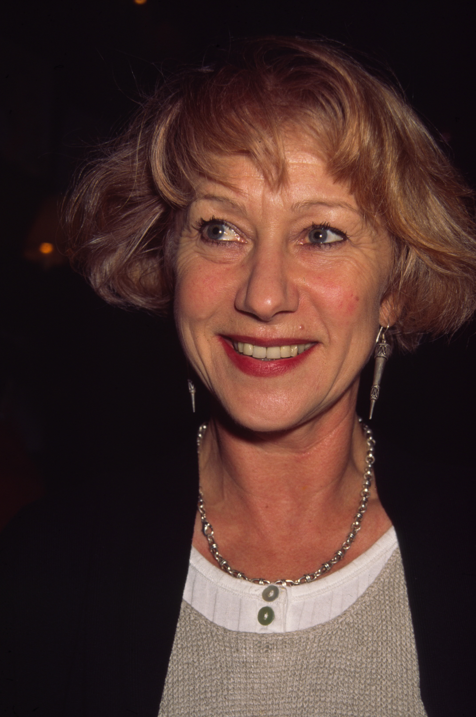 Helen Mirren wore a short, softly layered blonde bob with bangs at the National Board of Review Awards in New York City on February 24, 1992. The photograph captures her lighter hair color years before her silver-white bob became a familiar part of her public appearances. | Source: Getty Images