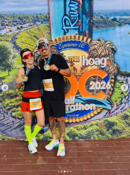 Moreno and Barrientos posed with their medals after completing the OC Marathon half-marathon in May. Moreno had started the year with a goal of running one mile after years of being medically excused from running in school because of her asthma. | Source: Instagram/eli_in_the_heli