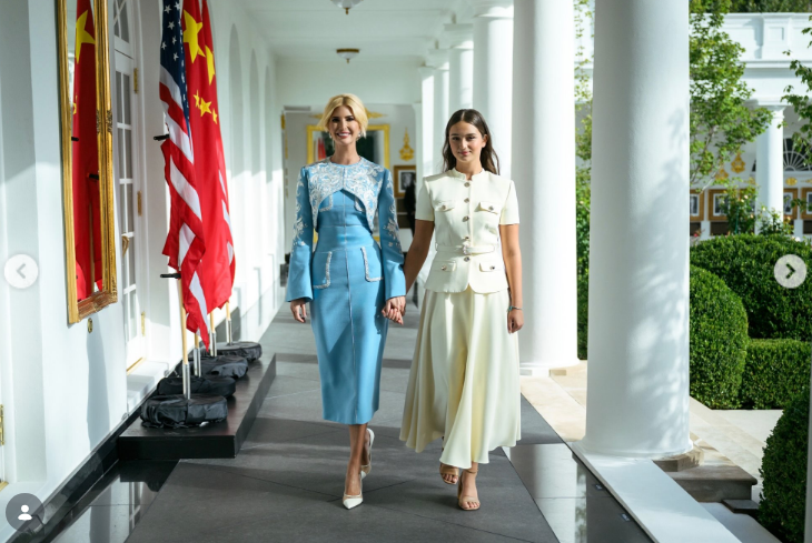 Ivanka Trump and Arabella Kushner strolled hand in hand down the White House Colonnade during events surrounding the state visit of Chinese President Xi Jinping. Passing beneath the iconic white pillars alongside the Rose Garden and the displayed flags of the United States and China, Arabella walked gracefully in her cream short-sleeved belted jacket and flowing midi skirt, with Ivanka smiling beside her in her embroidered powder-blue Guo Pei ensemble. | Source: Instagram/ivankatrump